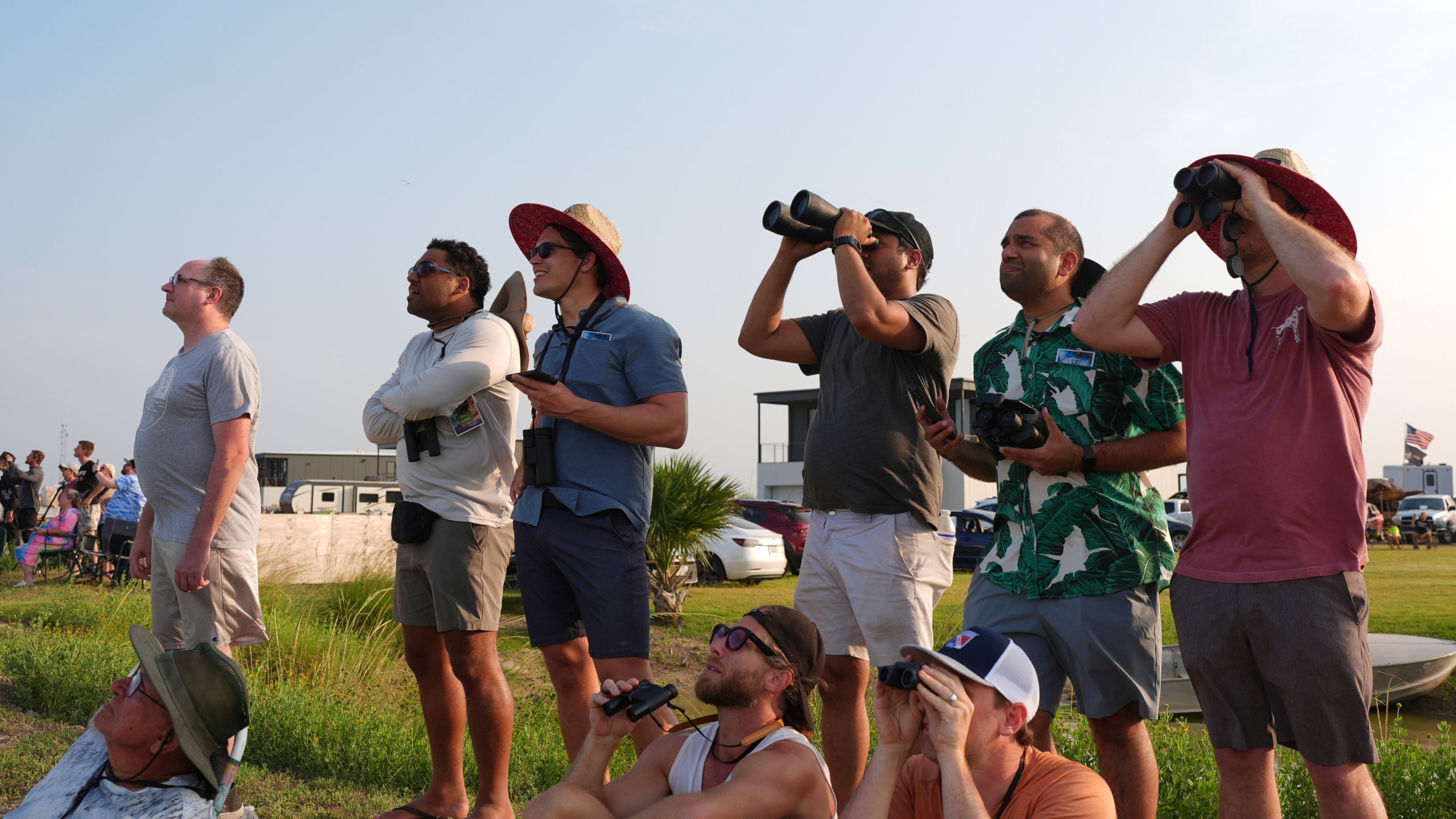 People watch as SpaceX's mega rocket Starship makes a test flight from Starbase, Texas, Tuesday, May 27, 2025. (AP Photo/Eric Gay)