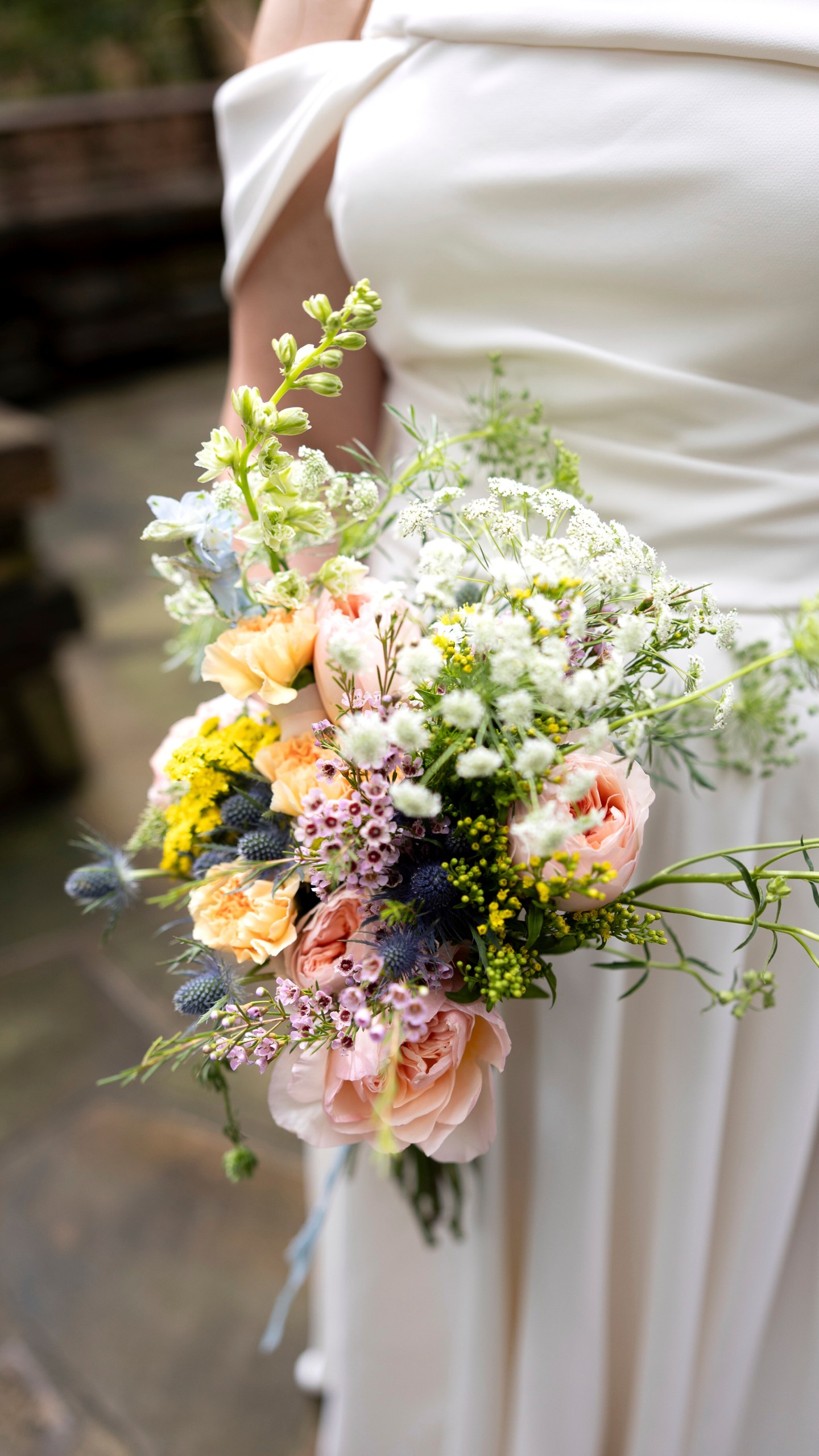 This Sept. 24, 2023, photo shows a bridal bouquet at a wedding in Hot Springs, Ark. Wedding vendors and bridal couples of today have been impacted by U.S. tariffs on countries around the globe. (Madi McGraw Photography via AP).