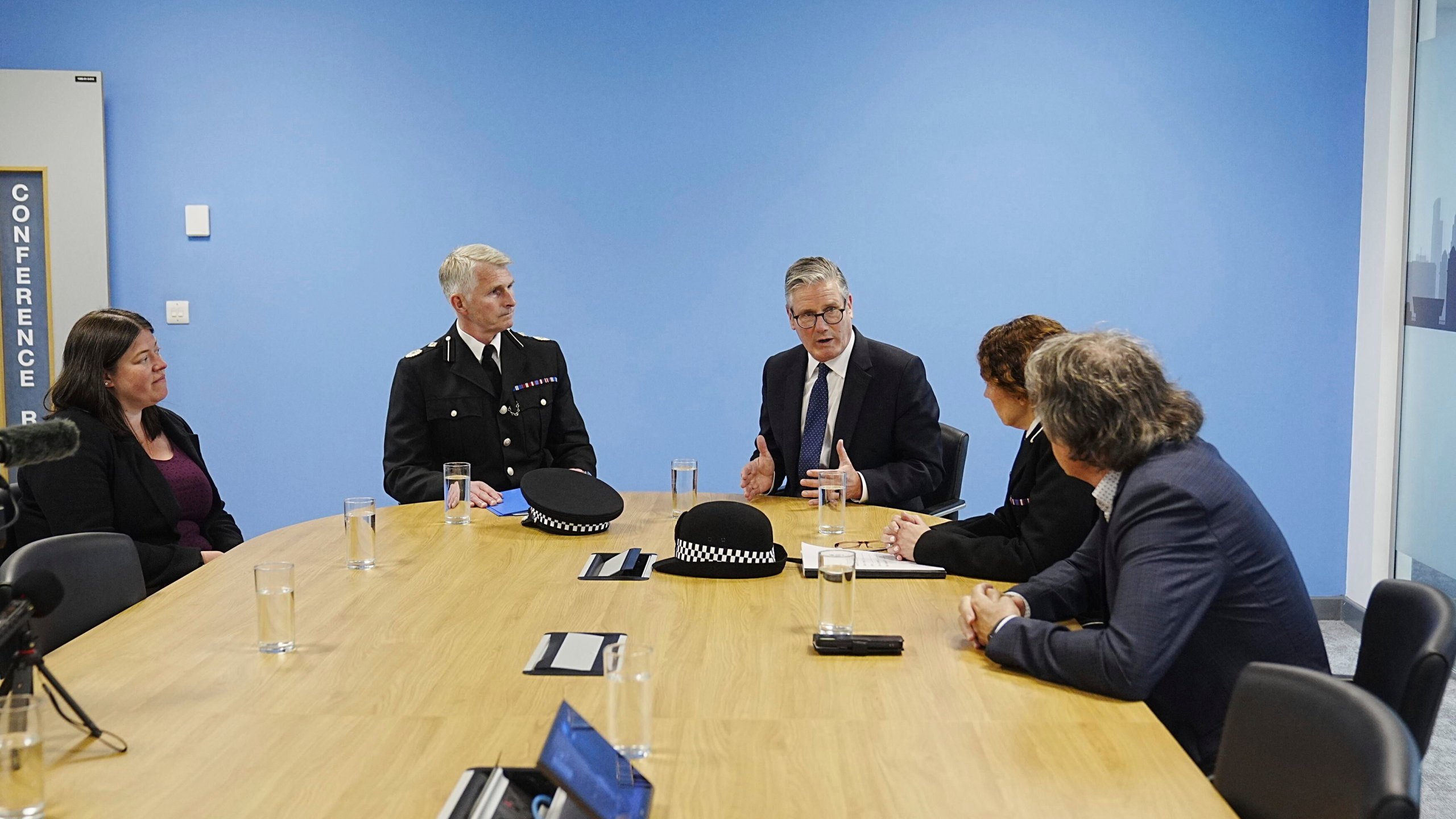 Britain's Prime Minister Sir Keir Starmer meeting with Police and Crime Commissioner Emily Spurrell, left, Deputy Chief Constable Chris Green, second left, Assistant Chief Constable Jenny Sims, and the Mayor of Liverpool City Region, Steve Rotheram, right, at Merseyside Police Headquarters, in Liverpool, England, Wednesday, May 28, 2025. (Peter Byrne/Pool photo via AP)