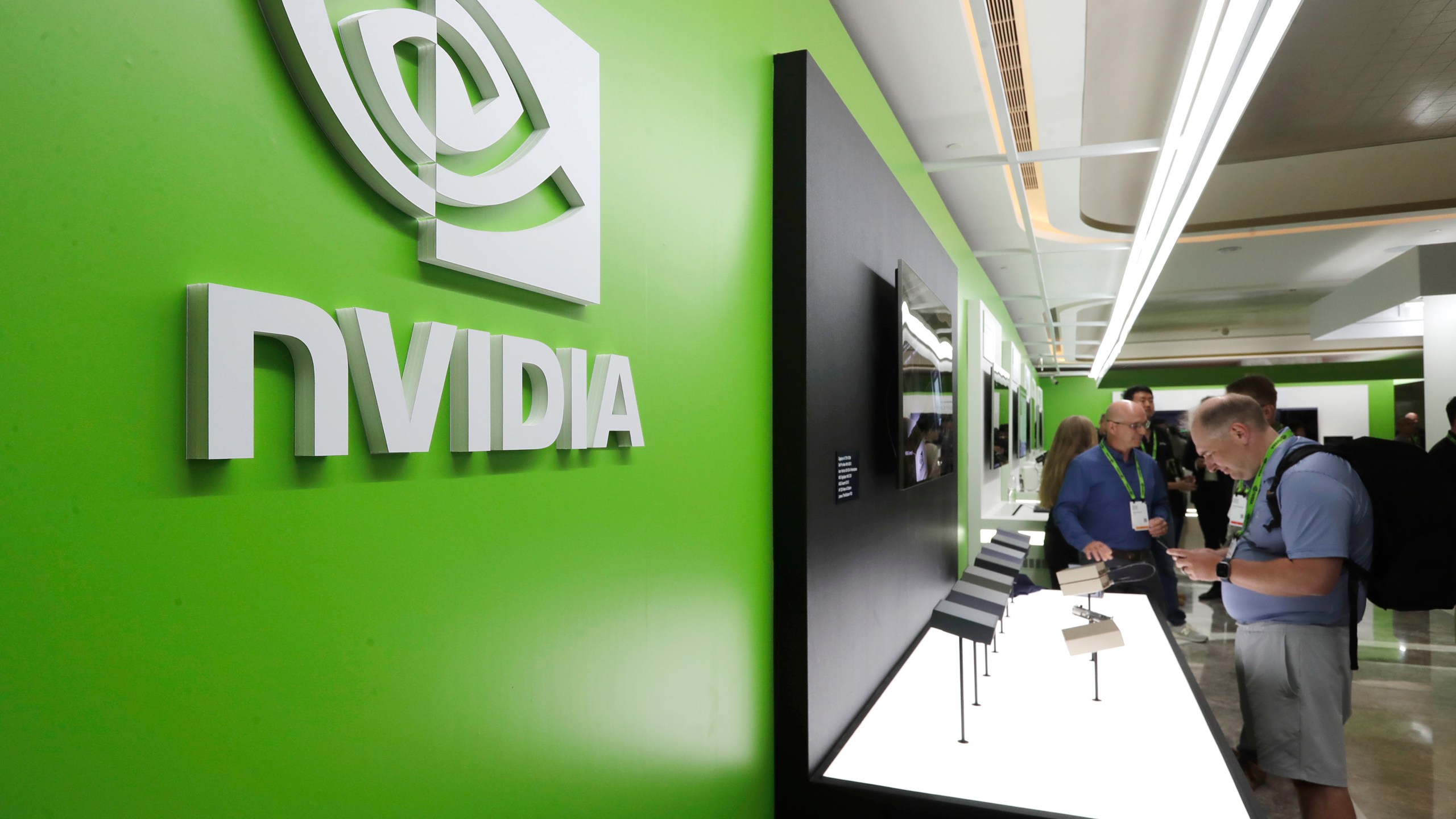 FILE - People take a look to Nvidia''s new products during the Computex 2025 exhibition in Taipei, Taiwan, Wednesday, May 21, 2025. (AP Photo/Chiang Ying-ying, File)