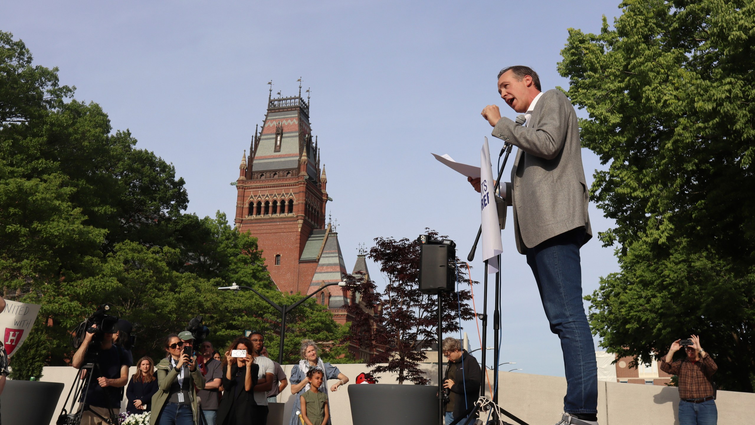 Ryan Enos, a government professor at Harvard University, speaks at a protest against President Donald Trump's recent sanctions against Harvard in front of Science Center Plaza on Tuesday, May 27, 2025, in Cambridge, Mass. (AP Photo/Leah Willingham)