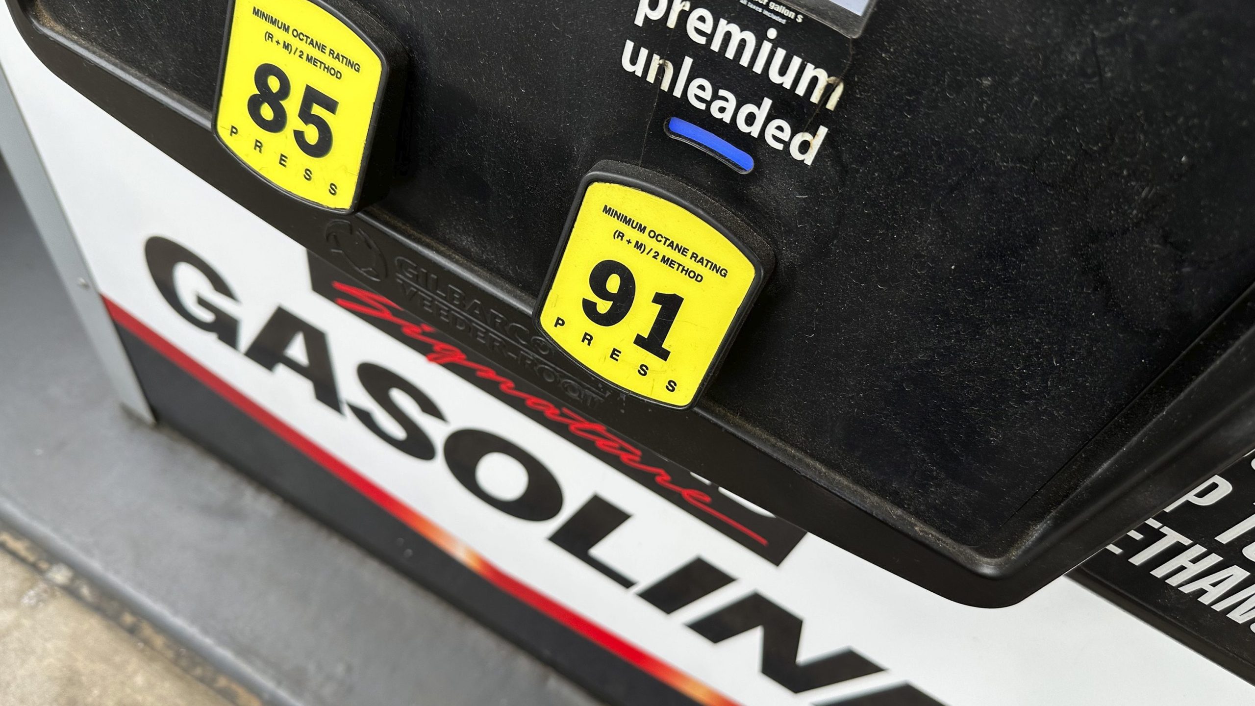 FILE - The per-gallon price is illuminated on the pump at a Costco warehouse gasoline station Tuesday, April 1, 2025, in Thornton, Colo. (AP Photo/David Zalubowski, File)