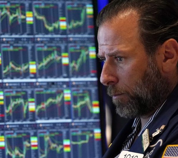 Specialist Michael Pistillo works on the floor of the New York Stock Exchange