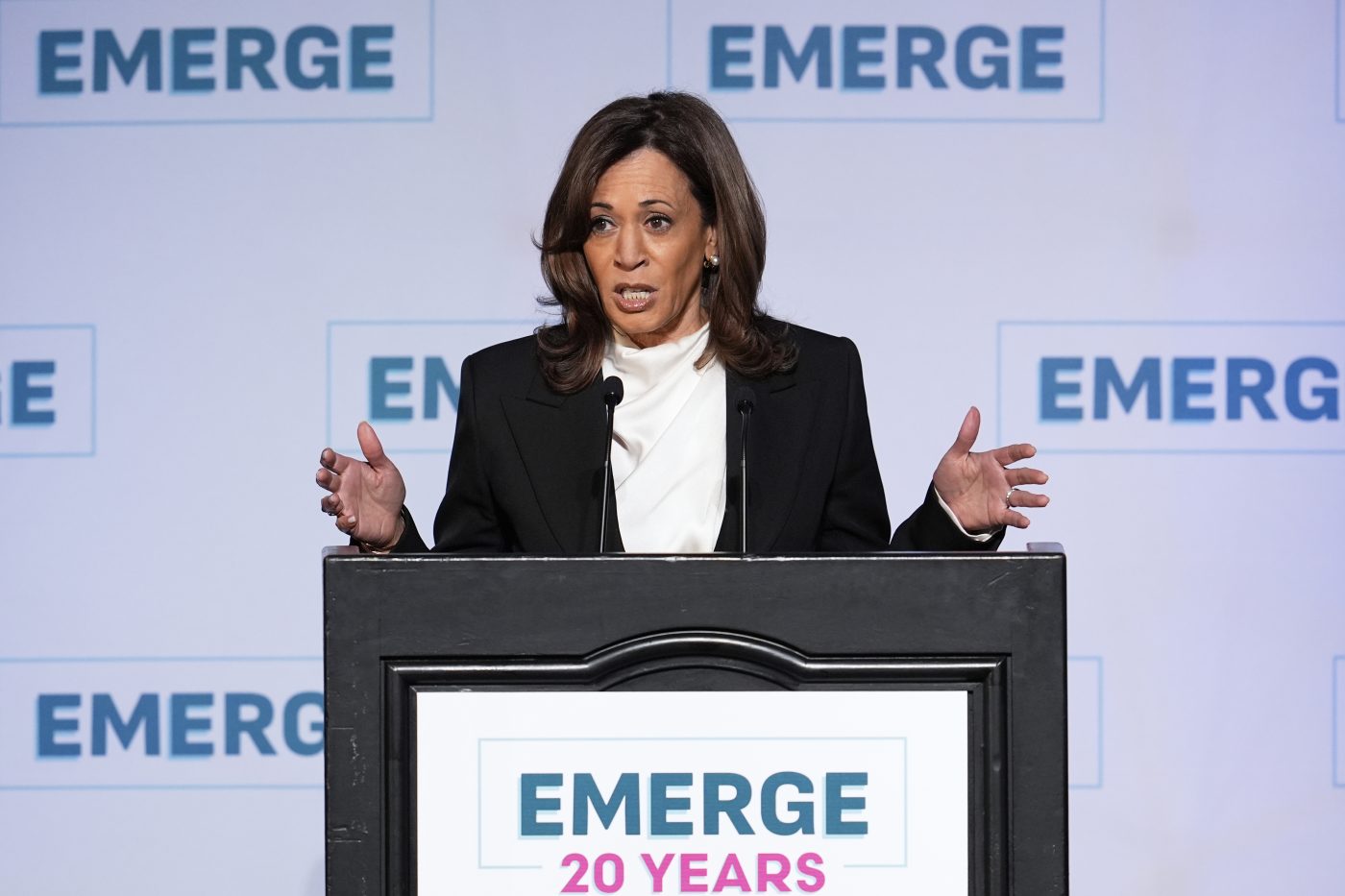 Harris speaking at a podium