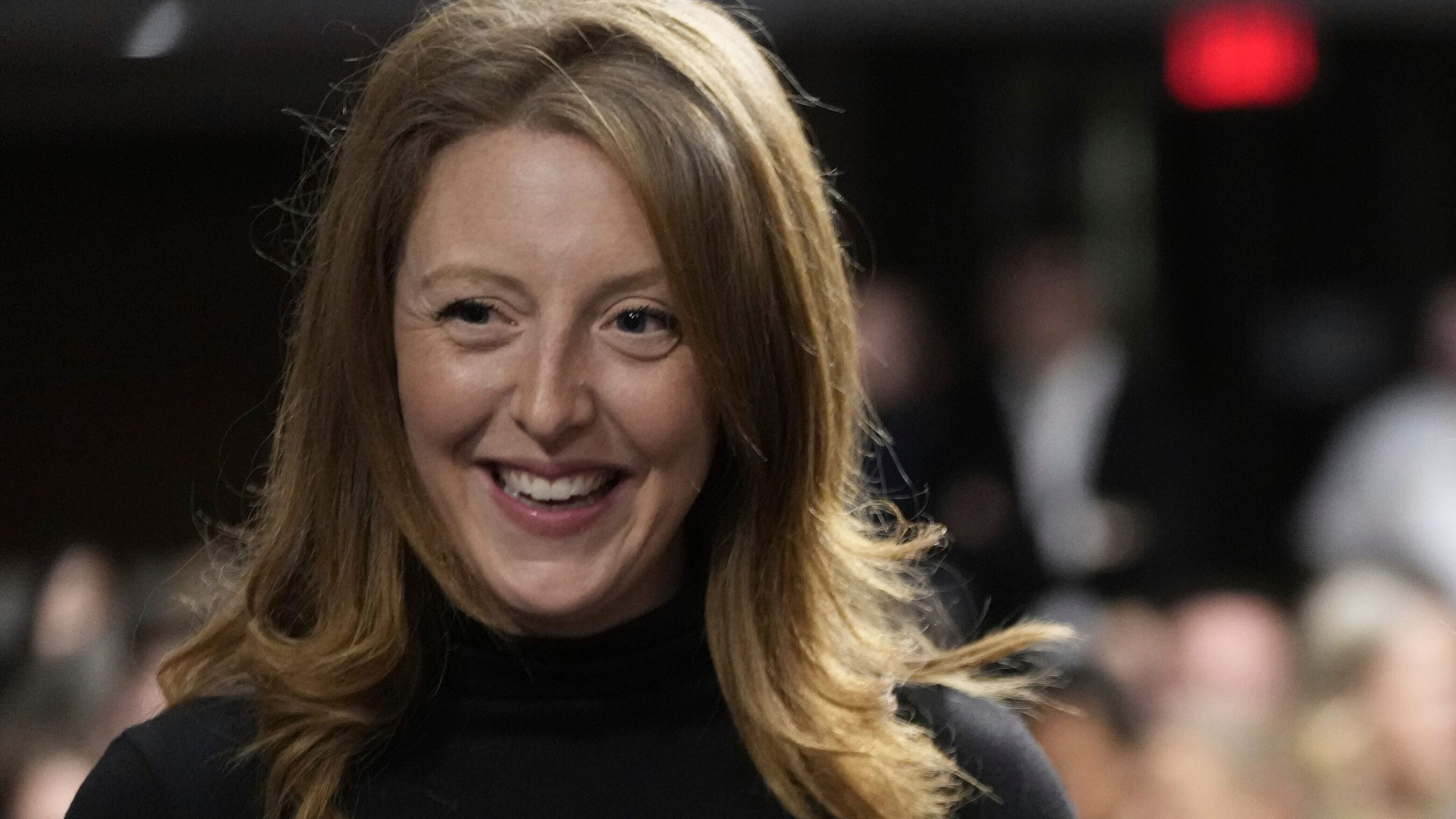 Casey Means smiles at a hearing