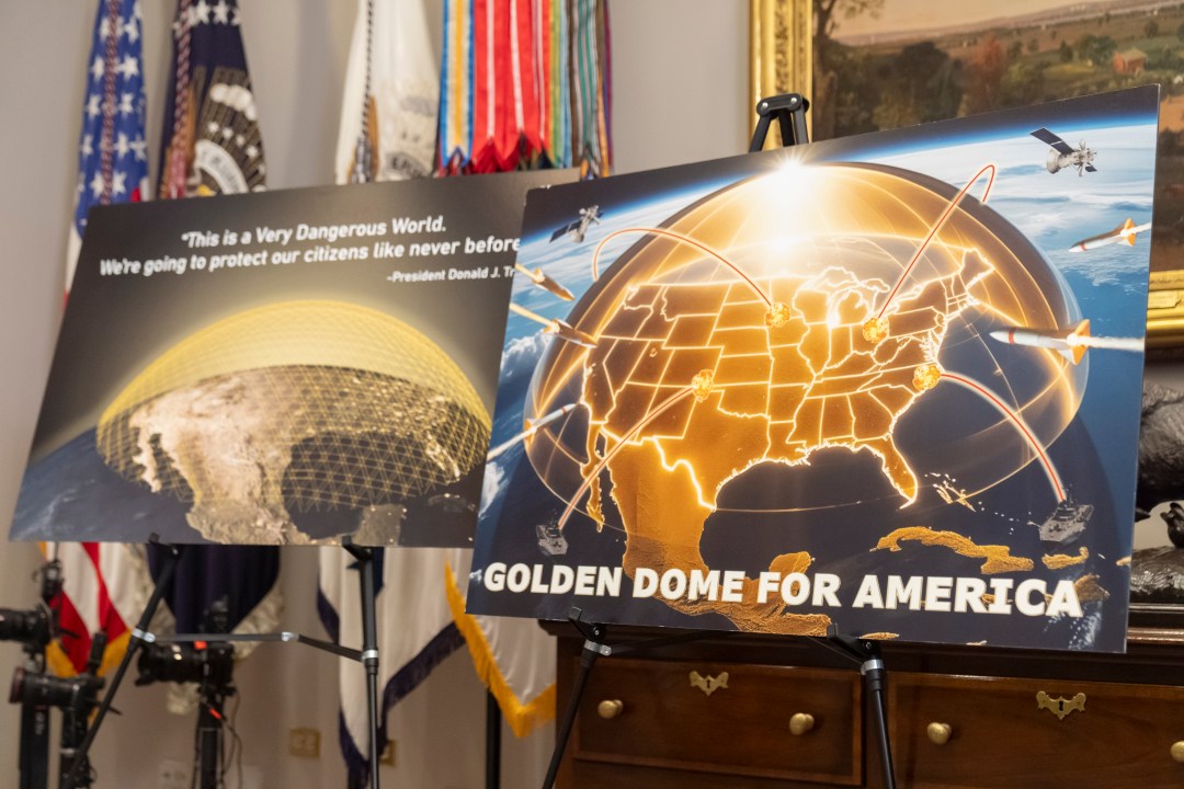 Posters for the proposed Golden Dome for America missile defense shield are displayed