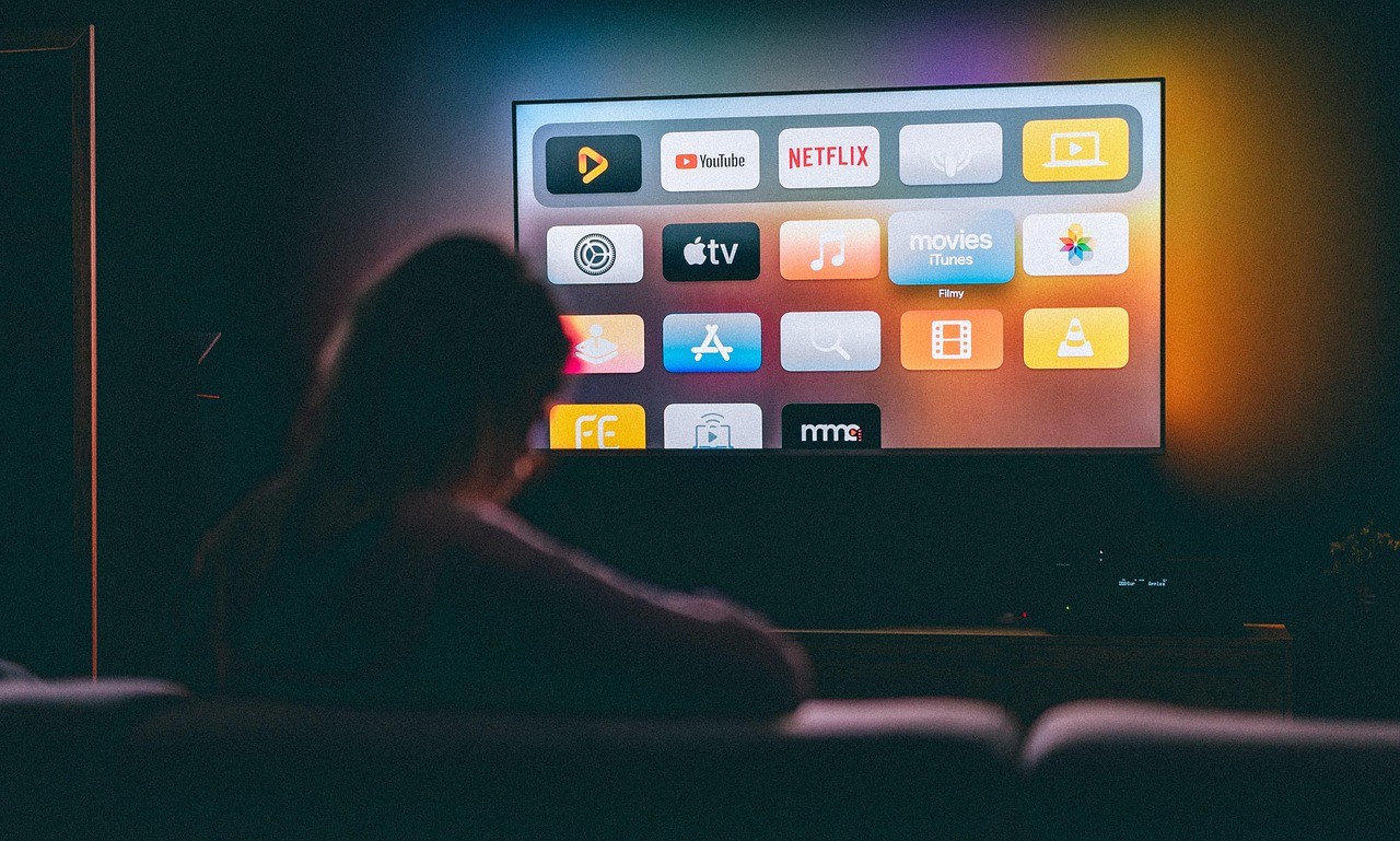 A viewer settles in to stream content on a television