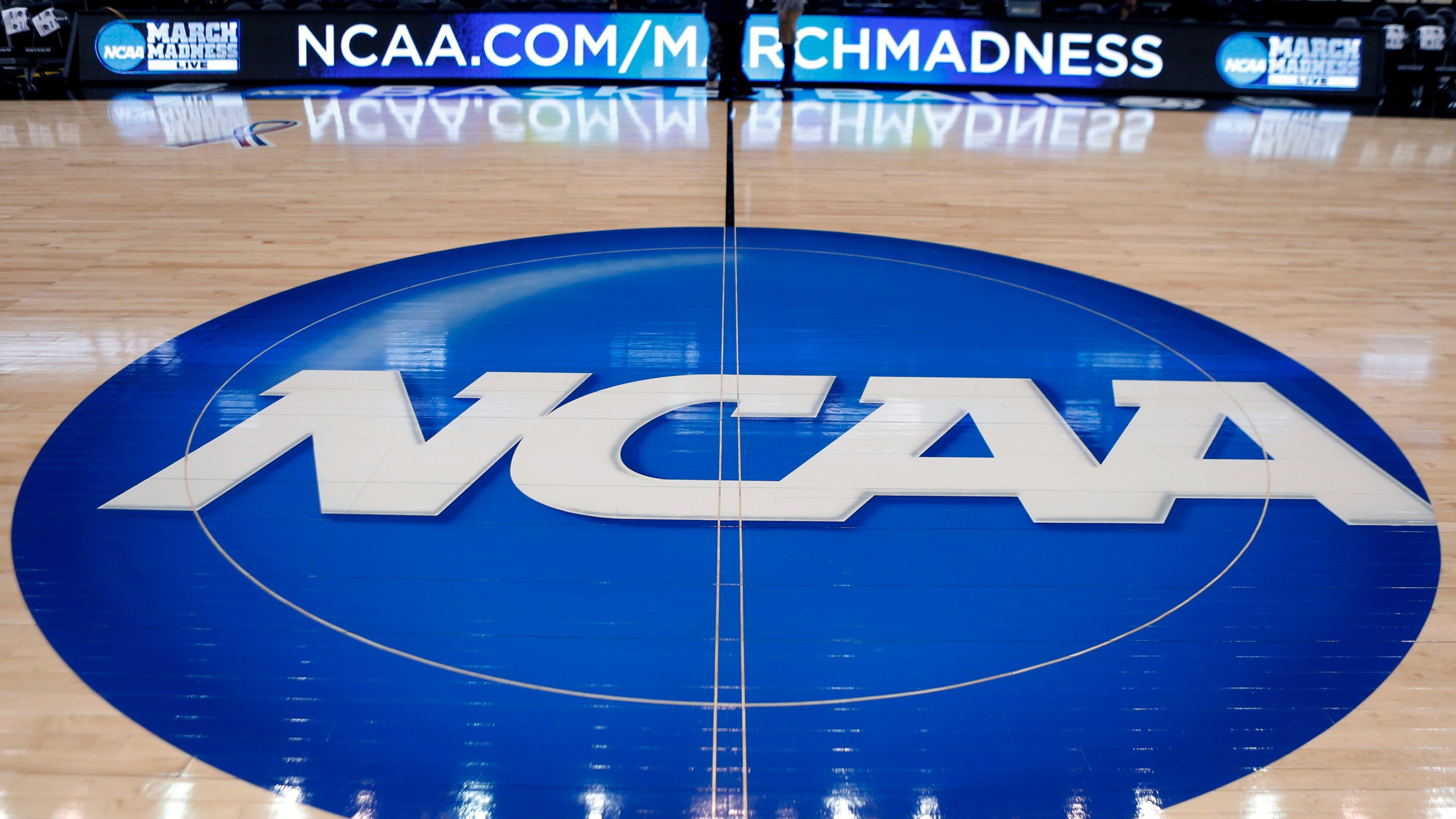 NCAA logo on a basketball court
