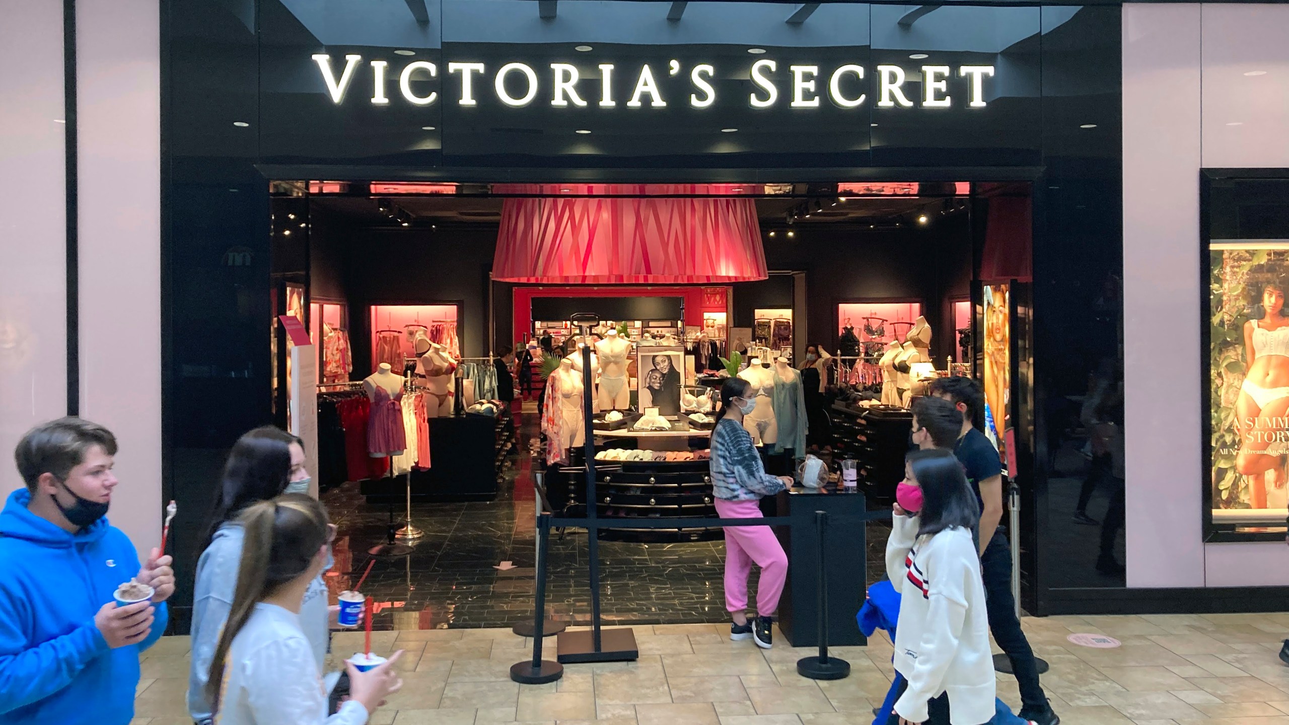FILE - Shoppers pass a Victoria's Secret store at a shopping mall in Scranton, Pa., May 3, 2021. (AP Photo/Ted Shaffrey, file)