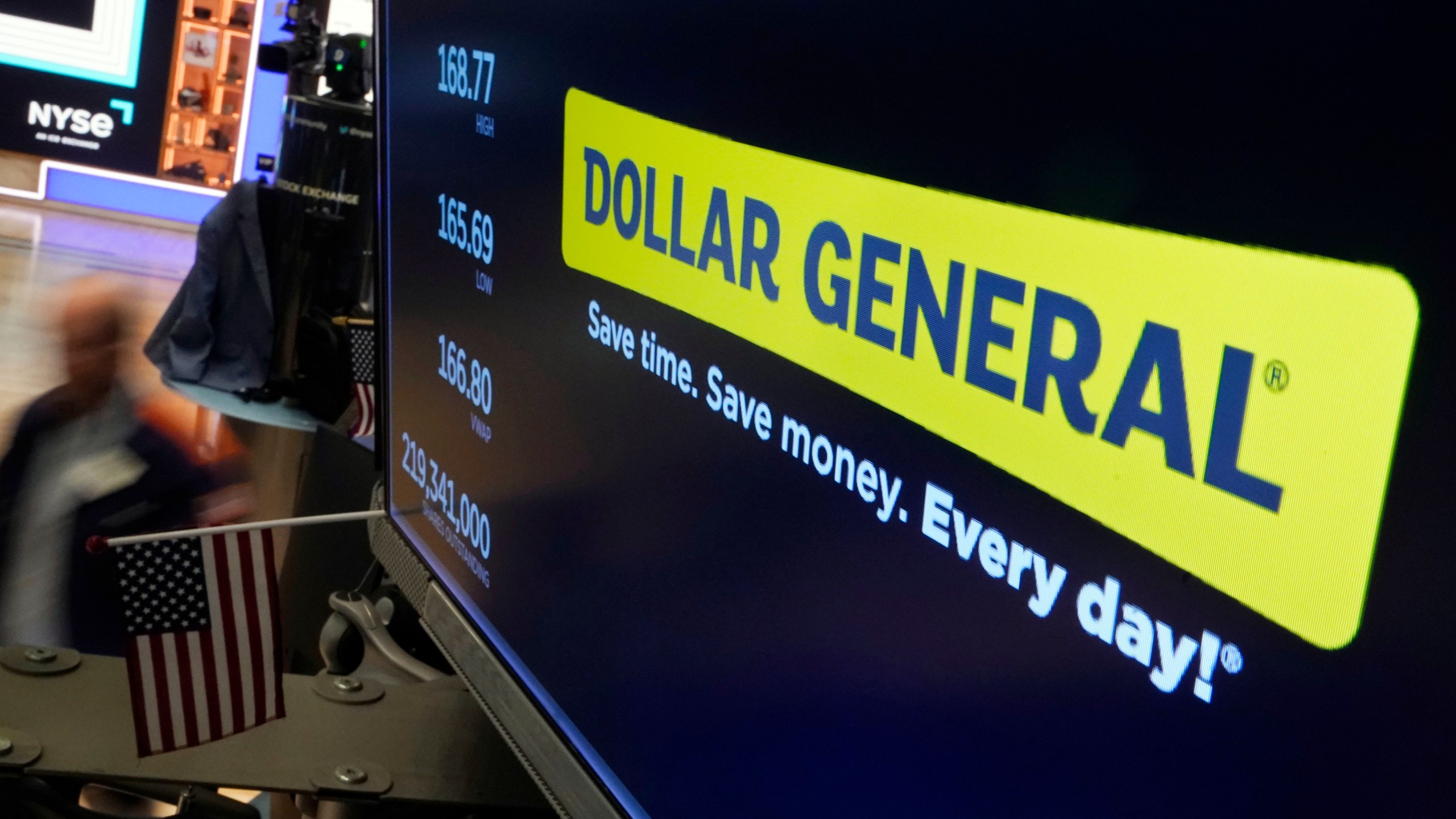FILE - The logo for Dollar General appears on a screen above a trading post on the floor of the New York Stock Exchange, July 13, 2023. (AP Photo/Richard Drew, File)
