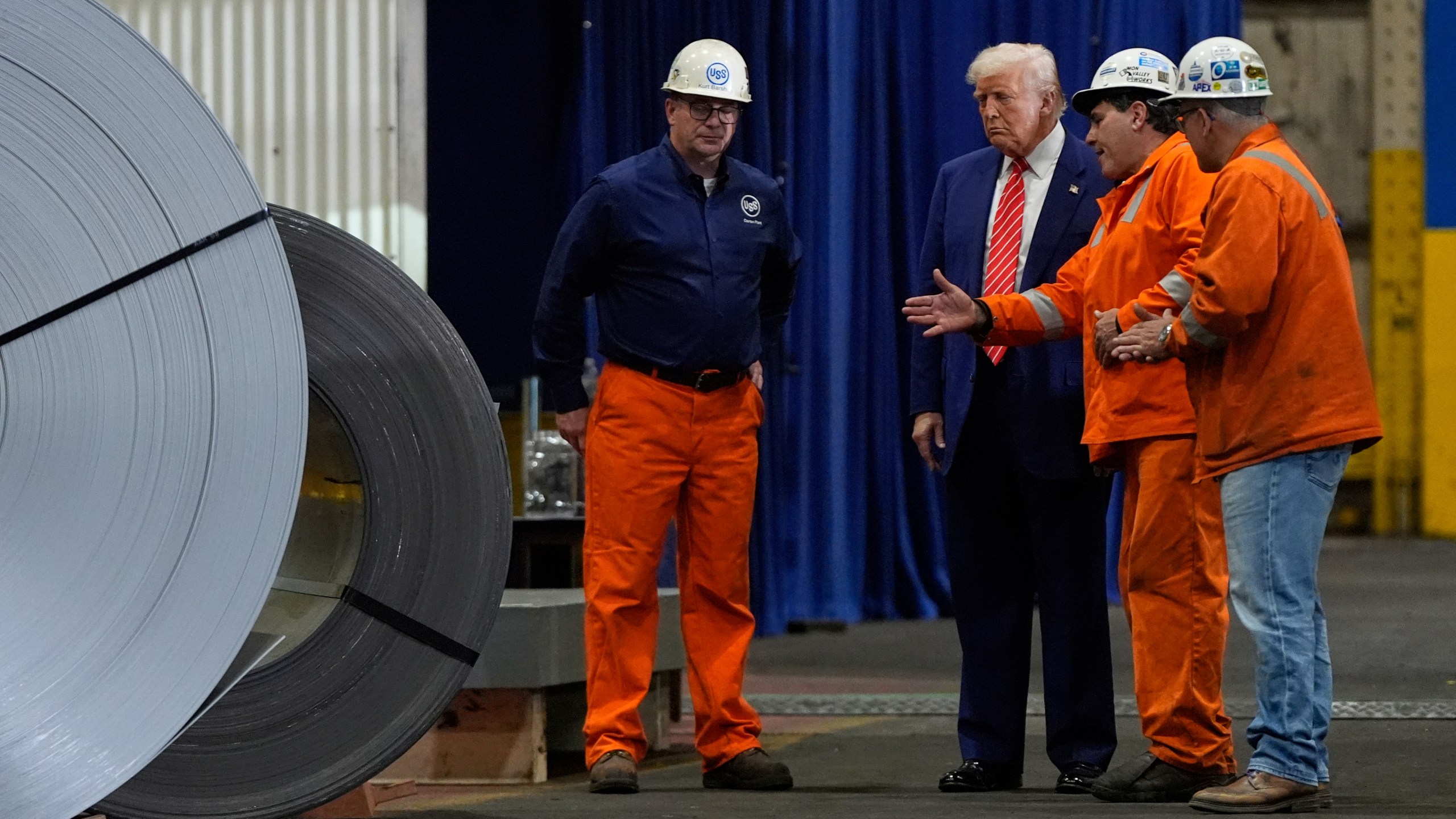 President Donald Trump talks to workers as he tours U.S. Steel Corporation's Mon Valley Works-Irvin plant, Friday, May 30, 2025, in West Mifflin, Pa. (AP Photo/Julia Demaree Nikhinson)