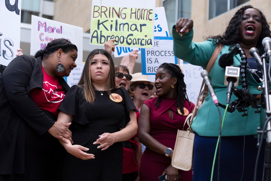 Wife of Kilmar Abrego Garcia, Jennifer Vasquez Sura, second from left, joins a rally outside the U.S. Courthouse in Greenbelt, Md., where a federal judge in Maryland will hear arguments Friday, May 16, 2025. (AP Photo/Manuel Balce Ceneta)