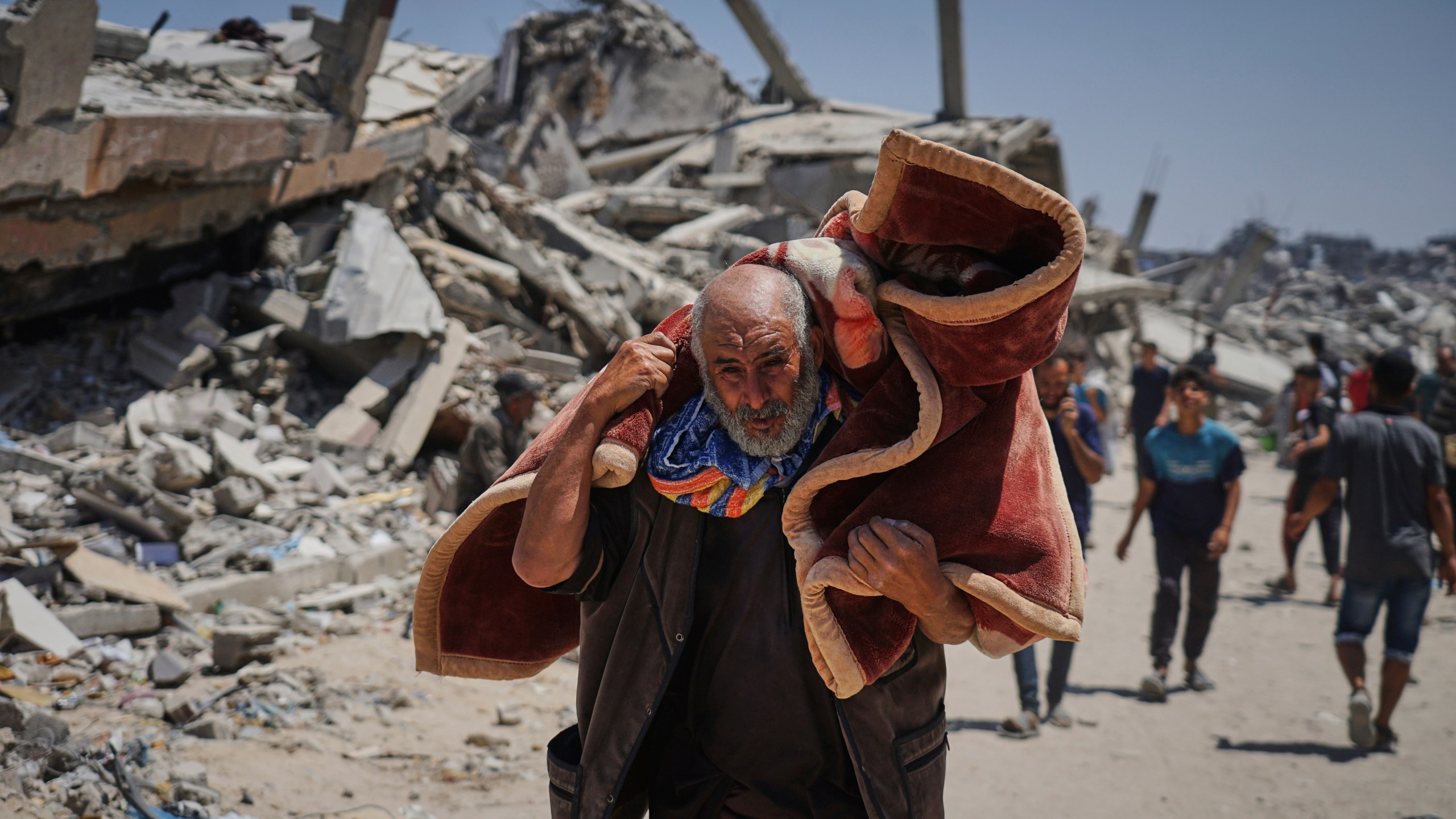 Displaced Palestinians return to retrieve their belongings from their homes in the area where the Israeli army operated in the northern Gaza Strip on Wednesday, June 4, 2025. (AP Photo/Jehad Alshrafi)