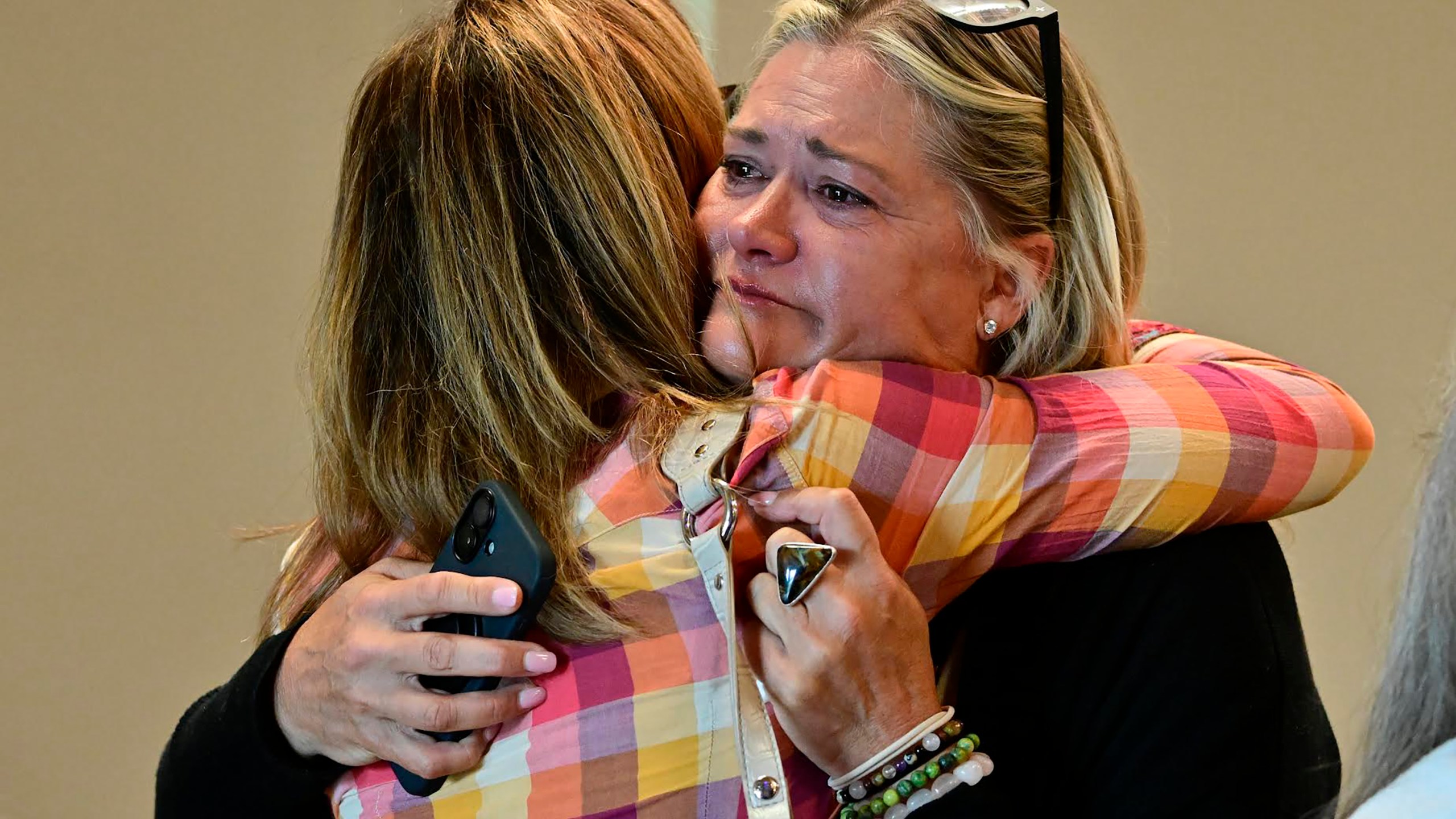 Lesli Colin Johnsen, right, hugs Beth Blacker before a community vigil at the Boulder Jewish Community Center, Wednesday, June 4, 2025, in Boulder, Colo. (Andy Cross/The Denver Post via AP, Pool)