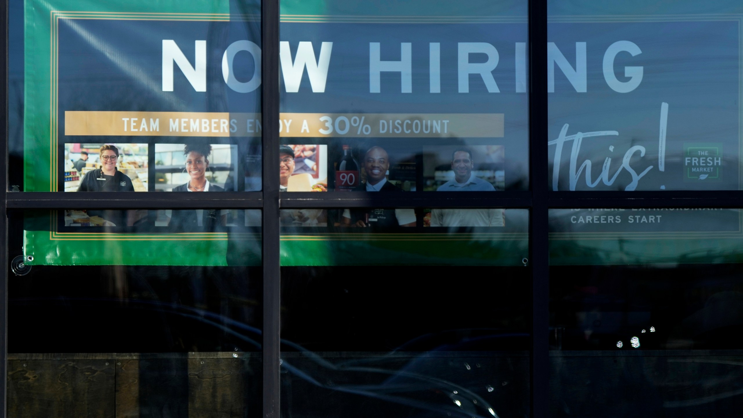 FILE - A hiring sign is displayed at a grocery store in Northbrook, Ill., Tuesday, Jan. 21, 2025. (AP Photo/Nam Y. Huh)
