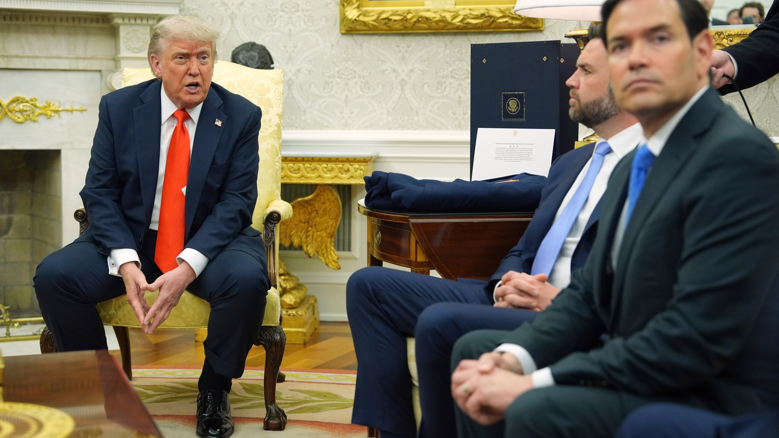 President Donald Trump, left, speaks during a meet withGermany's Chancellor Friedrich Merz, not pictured, as Secretary of State Marco Rubio, from right, and Vice President JD Vance listen in the Oval Office of the White House, Thursday, June 5, 2025, in Washington. (AP Photo/Evan Vucci)