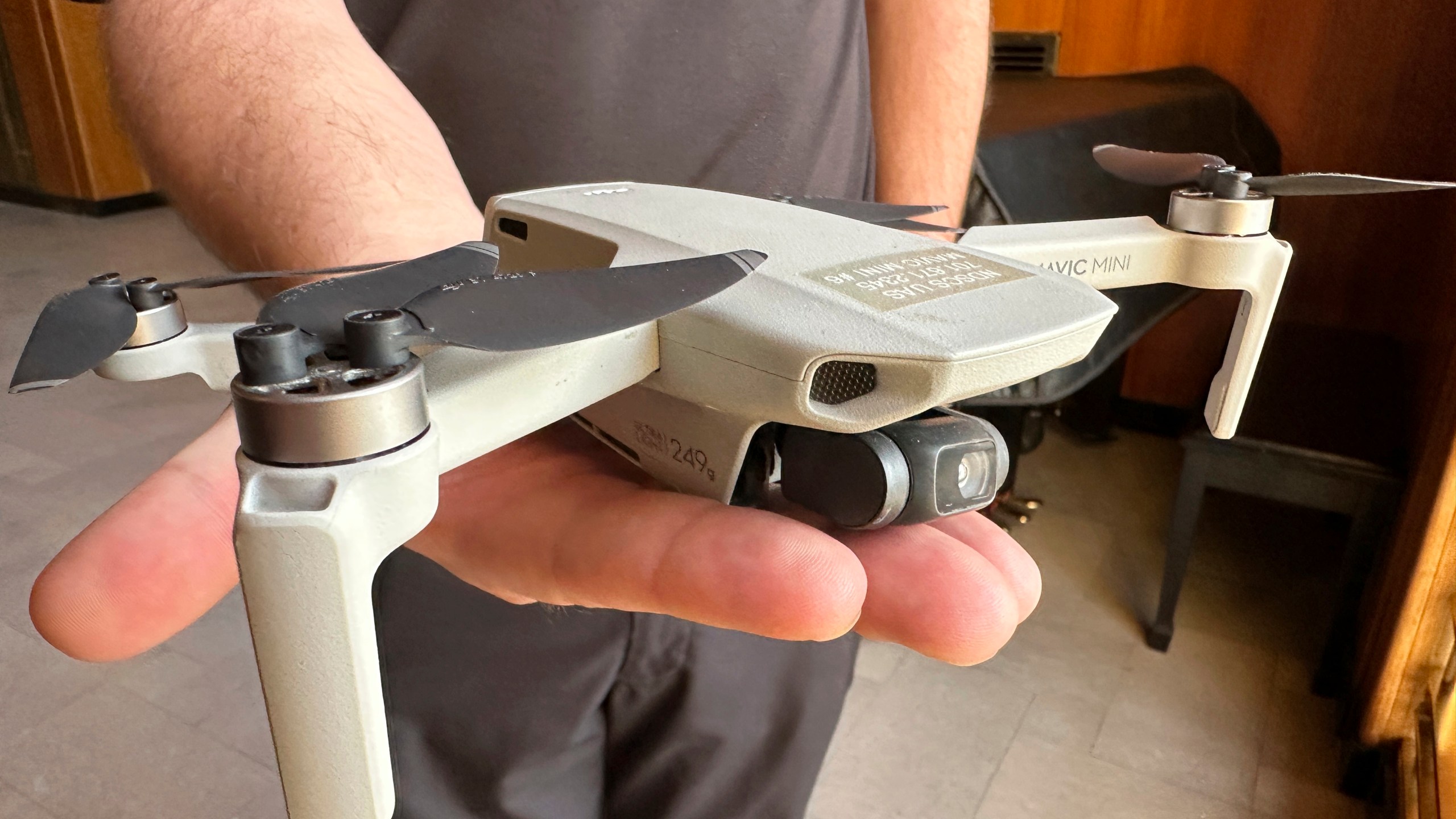 FILE - Seth Simonson, assistant professor/UAS curriculum lead for the North Dakota State College of Science, holds a Chinese-manufactured drone the college mainly uses for pilot training and photo and video collecting by students, at the state Capitol in Bismarck, N.D., on Jan. 15, 2025, (AP Photo/Jack Dura, File)