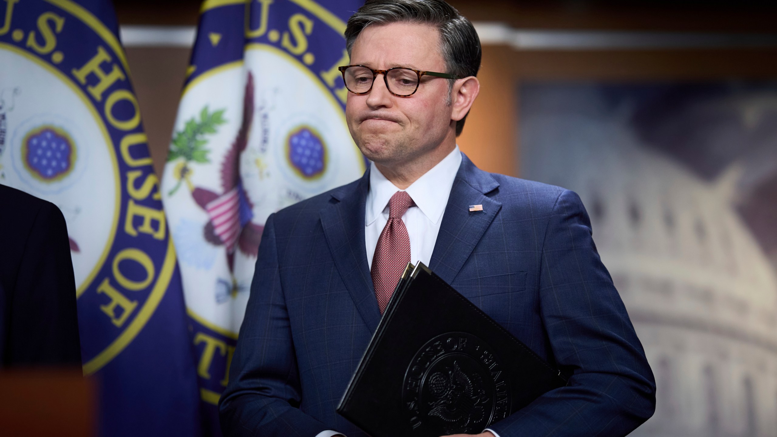Speaker of the House Mike Johnson pauses as he meets with reporters