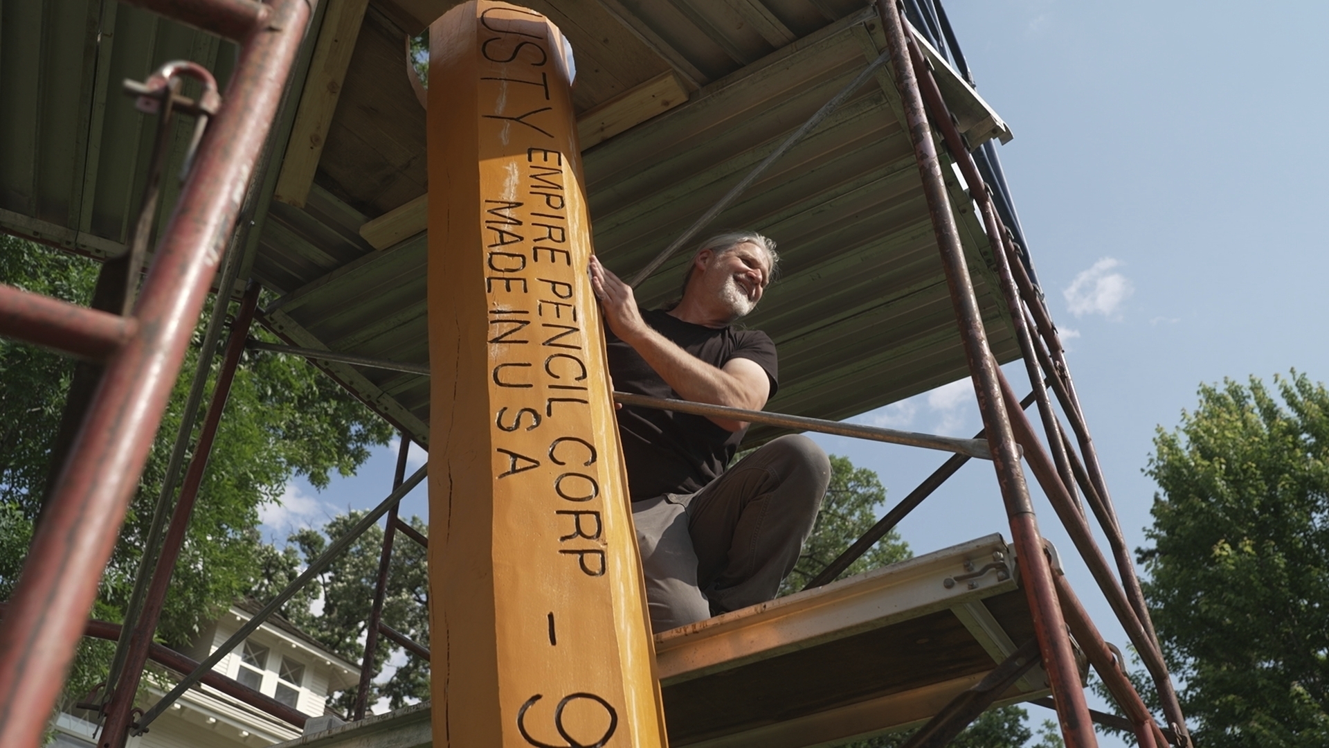 Artist Curtis Ingvoldstad touches up his 20-foot-tall pencil sculpture ahead of its annual sharpening on Wednesday, June 4, 2025 in Minneapolis, Minn. (AP photo/Mark Vancleave)