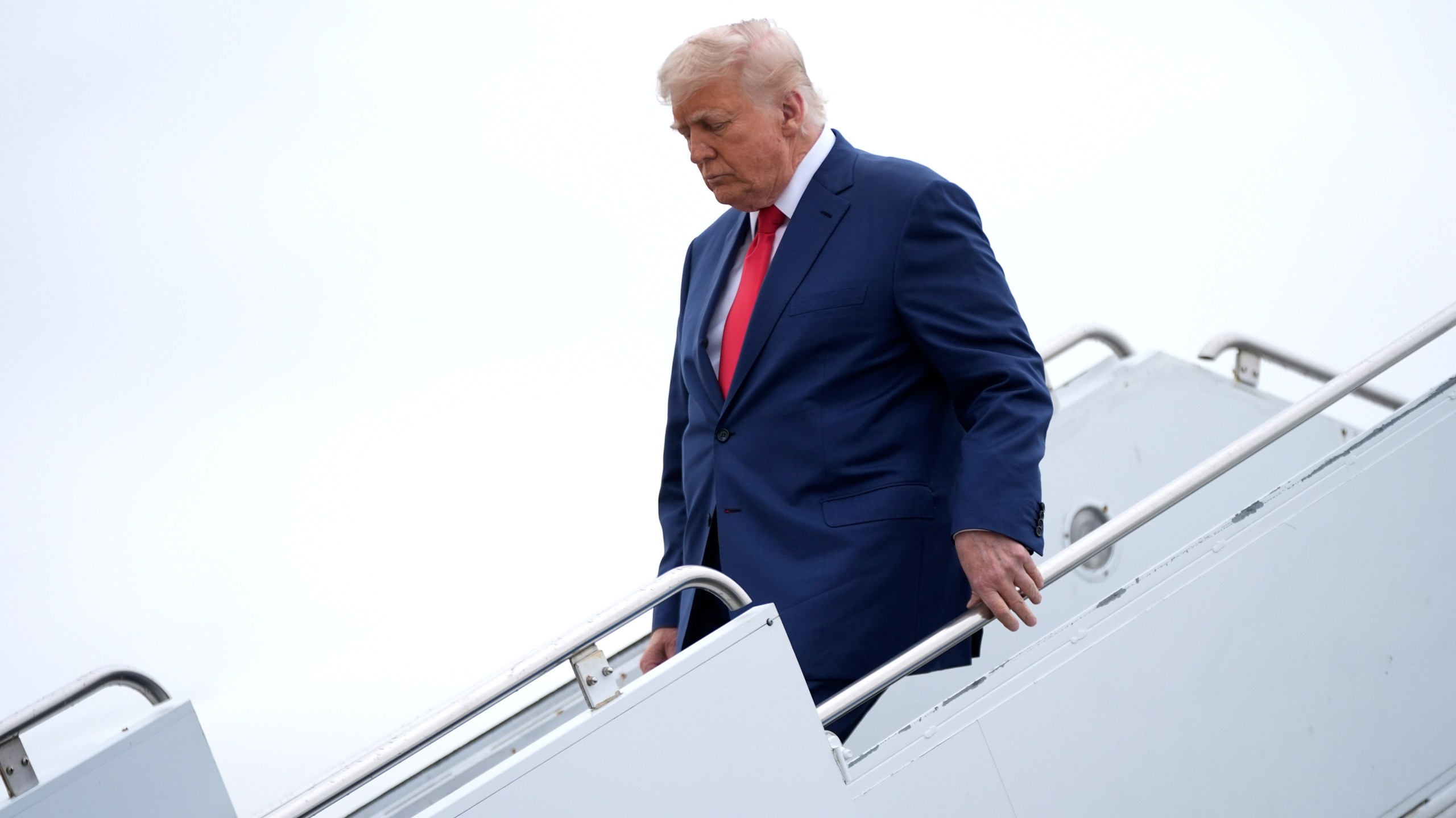 President Donald Trump arrives on Air Force One at Hagerstown Regional Airport, in Hagerstown, Md., on his was to Camp David, Md., Sunday, June 8, 2025. (AP Photo/Manuel Balce Ceneta)