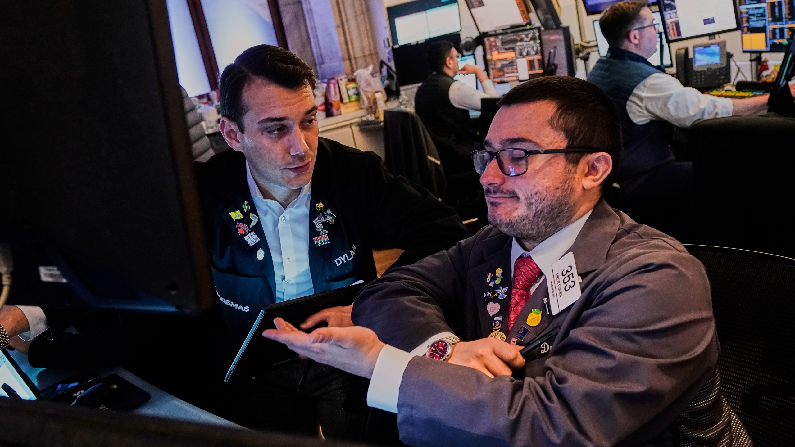 Traders Dylan Halvorsan, left, and Drew Cohen work on the floor of the New York Stock Exchange, Monday, June 9, 2025. (AP Photo/Richard Drew)