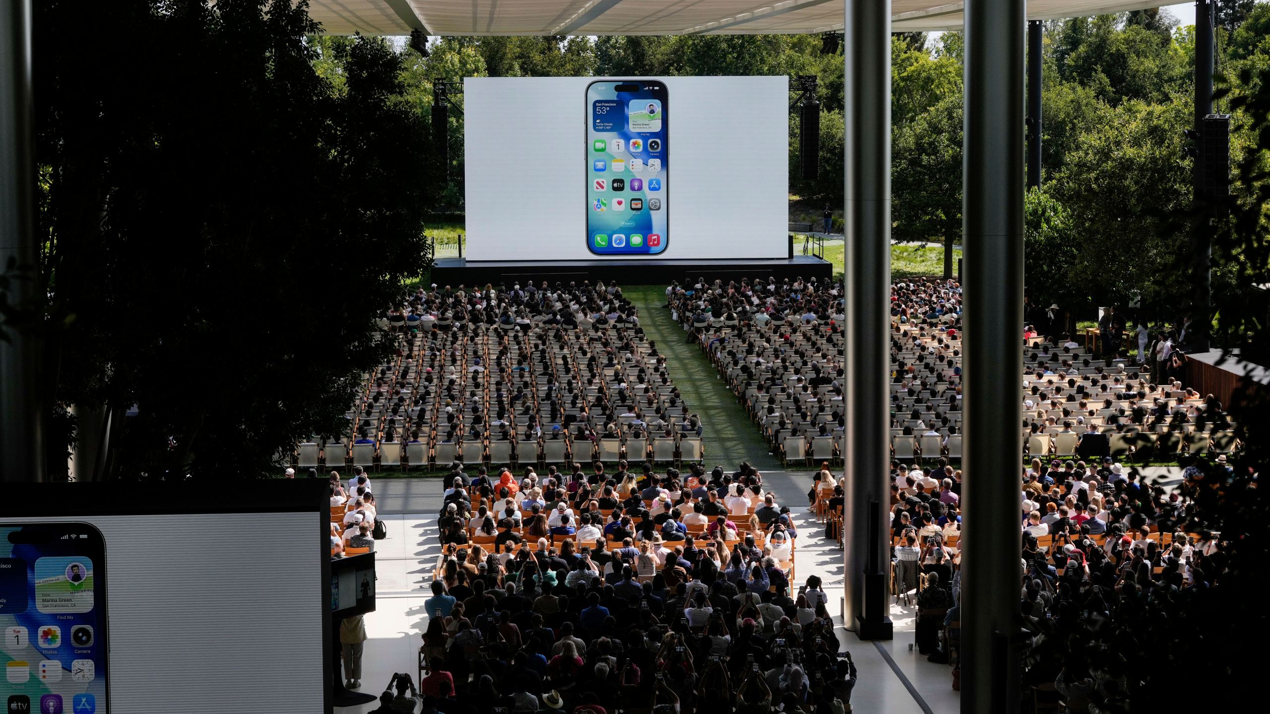 Attendees watch a presentation during an event on the Apple campus in Cupertino, Calif., Monday, June 9, 2025. (AP Photo/Jeff Chiu)
