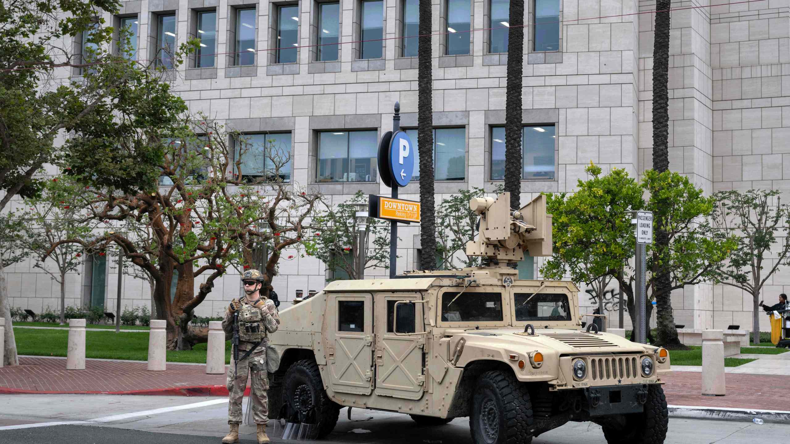 The California National Guard arrives to stand watch outside the Ronald Reagan Federal Building and Courthouse in Santa Ana, Calif., Tuesday, June 10, 2025, after Monday's protests against President Trump's ICE raids resulted in violence. (Mindy Schauer/The Orange County Register via AP)