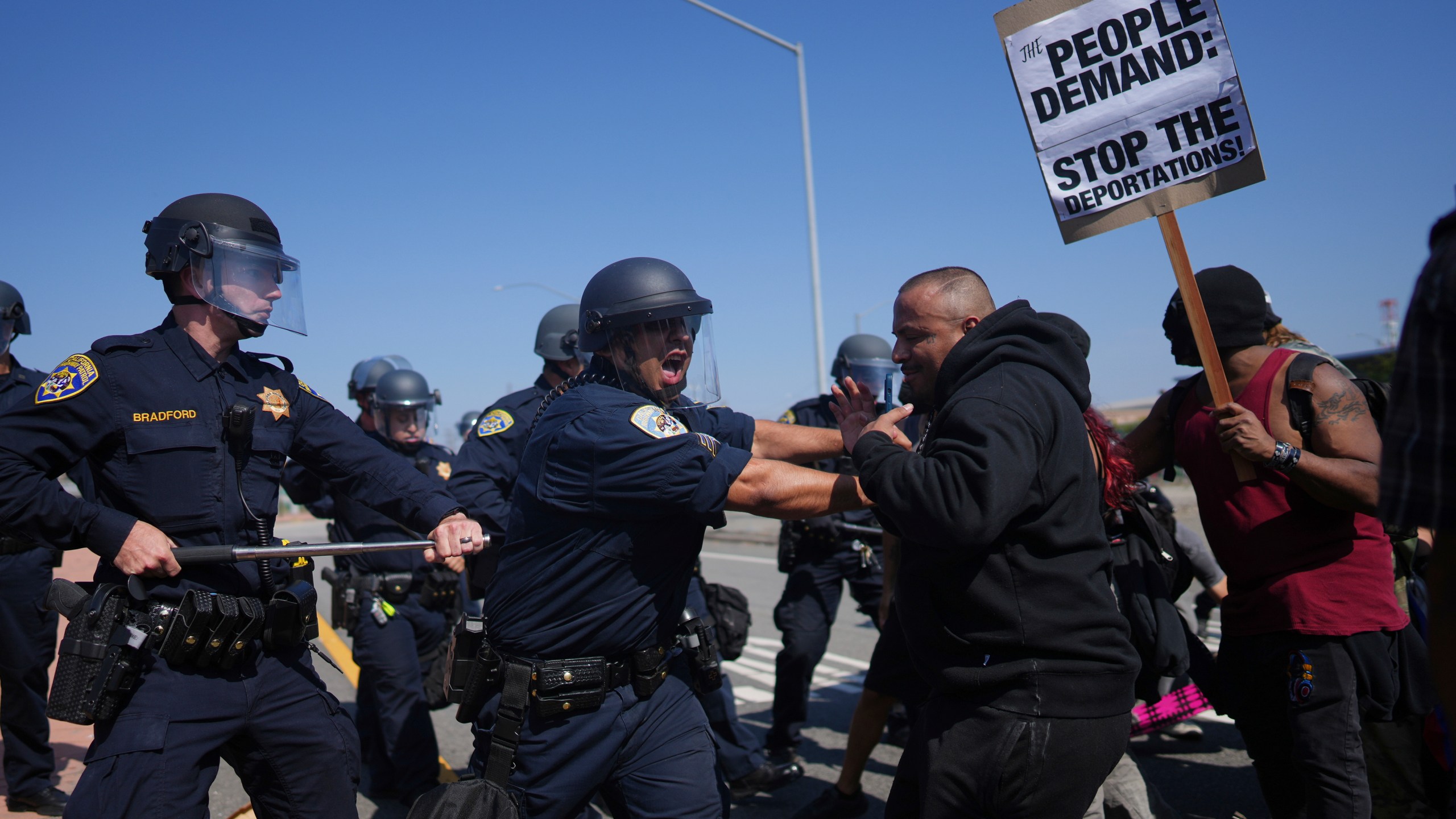 California Highway Patrol officers clash with protesters on Tuesday, June 10, 2025, in Los Angeles. (AP Photo/Eric Thayer)
