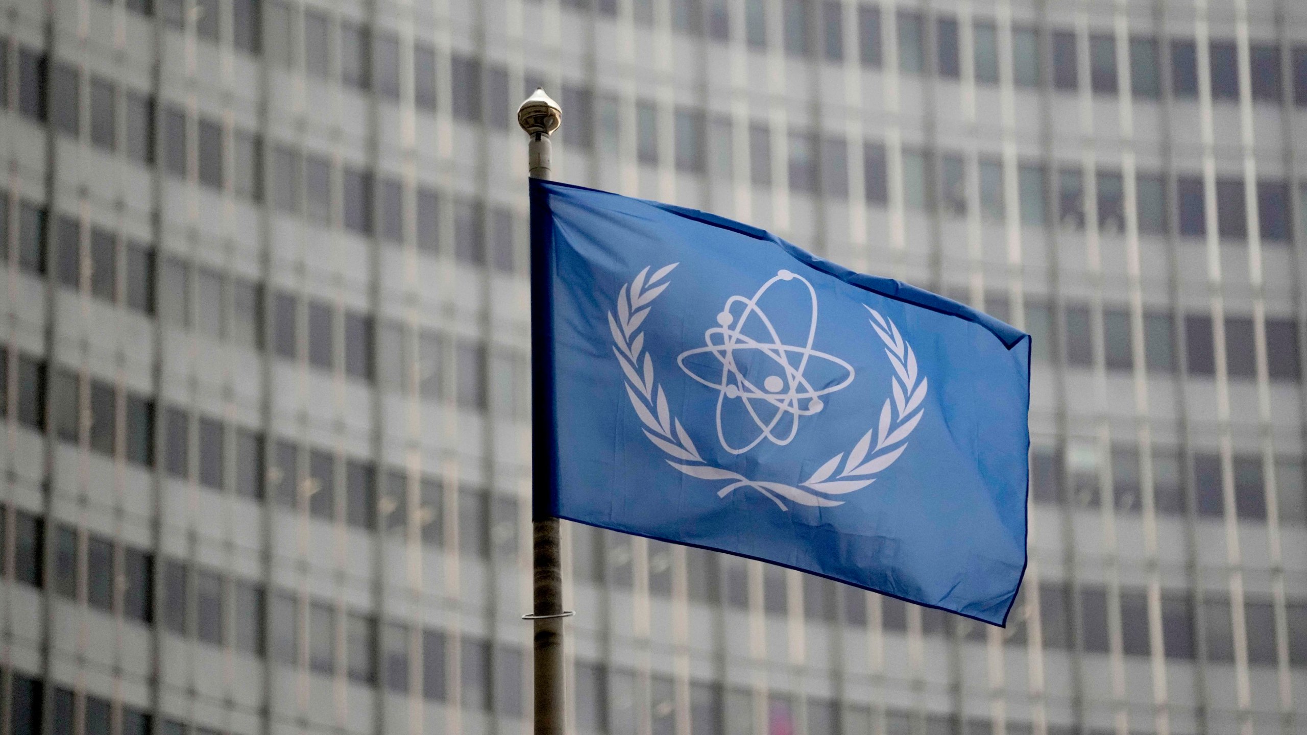The flag of the International Atomic Energy Agency flies in front of its headquarters