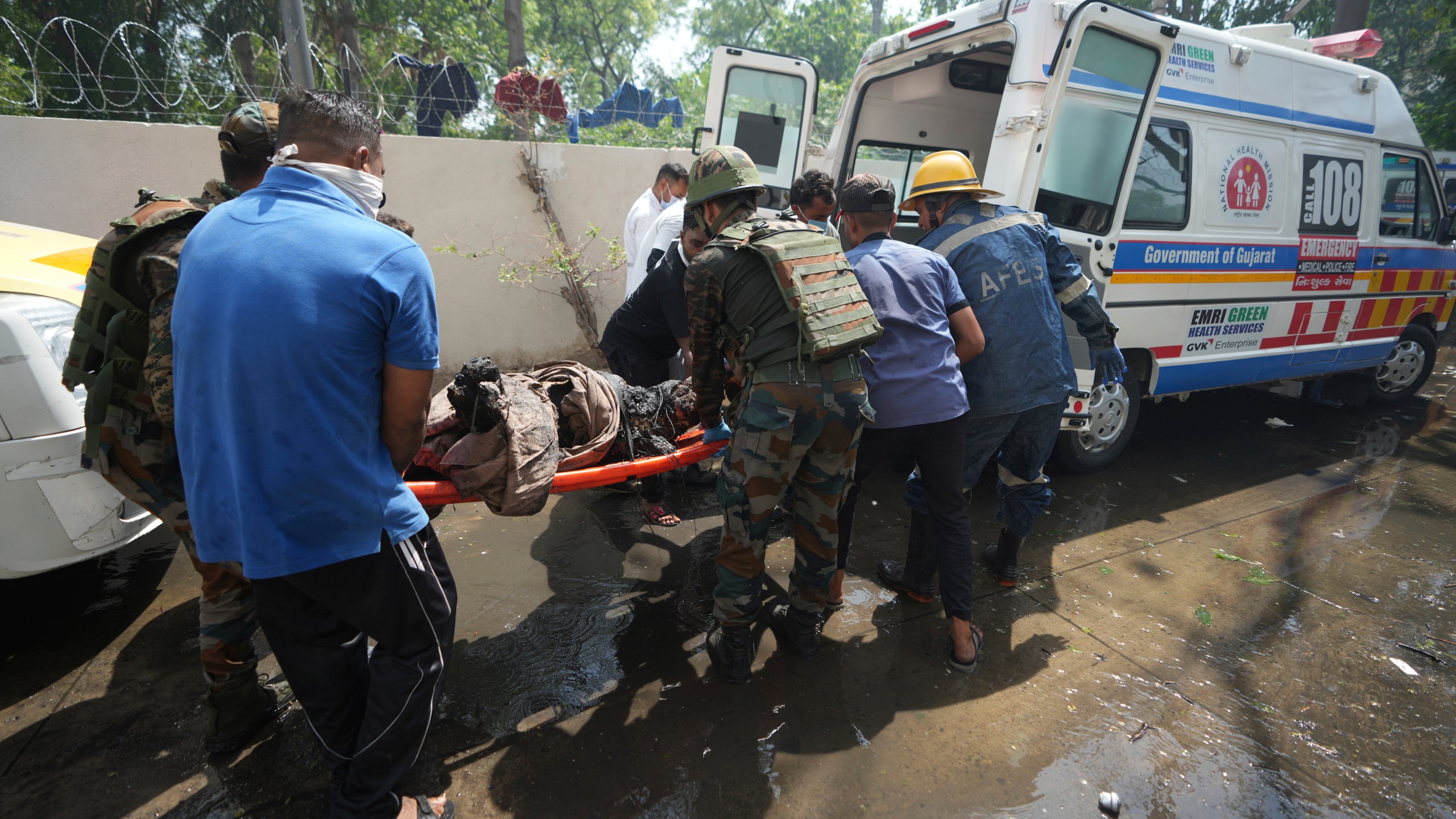 EDS NOTE: GRAPHIC CONTENT - Rescue workers at the site of an airplane that crashed in India's northwestern city of Ahmedabad in Gujarat state, Thursday, June12, 2025. (AP Photo/Ajit Solanki)
