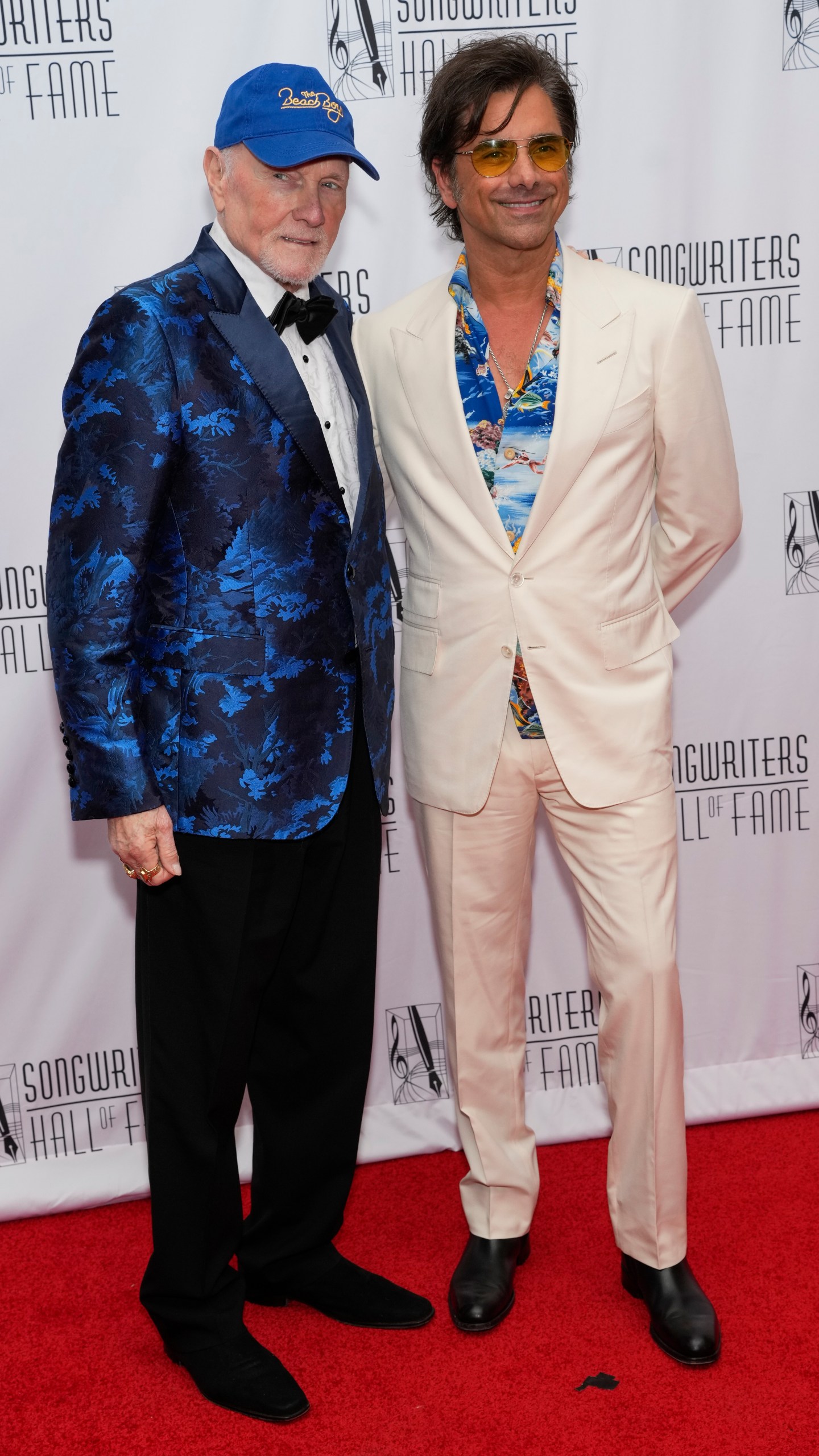 Mike Love, left, and John Stamos attend the 54th annual Songwriters Hall of Fame induction and awards gala on Thursday, June 12, 2025, at the Marriott Marquis Hotel in New York. (Photo by Charles Sykes/Invision/AP)
