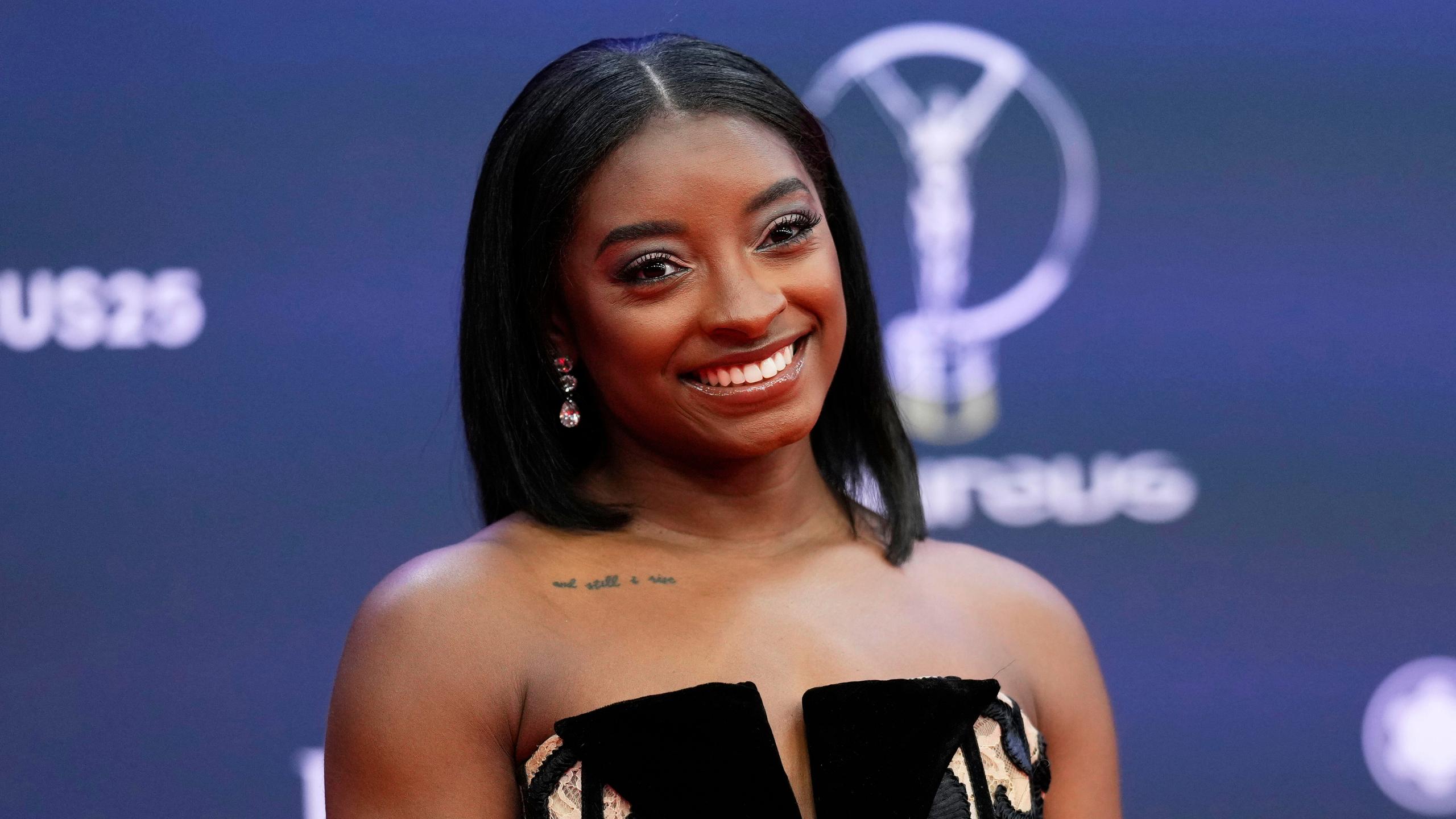 Simone Biles, of the United States, poses in a black dress during the 2025 Laureus World Sports Awards in Madrid, Spain, Monday, April 21, 2025.