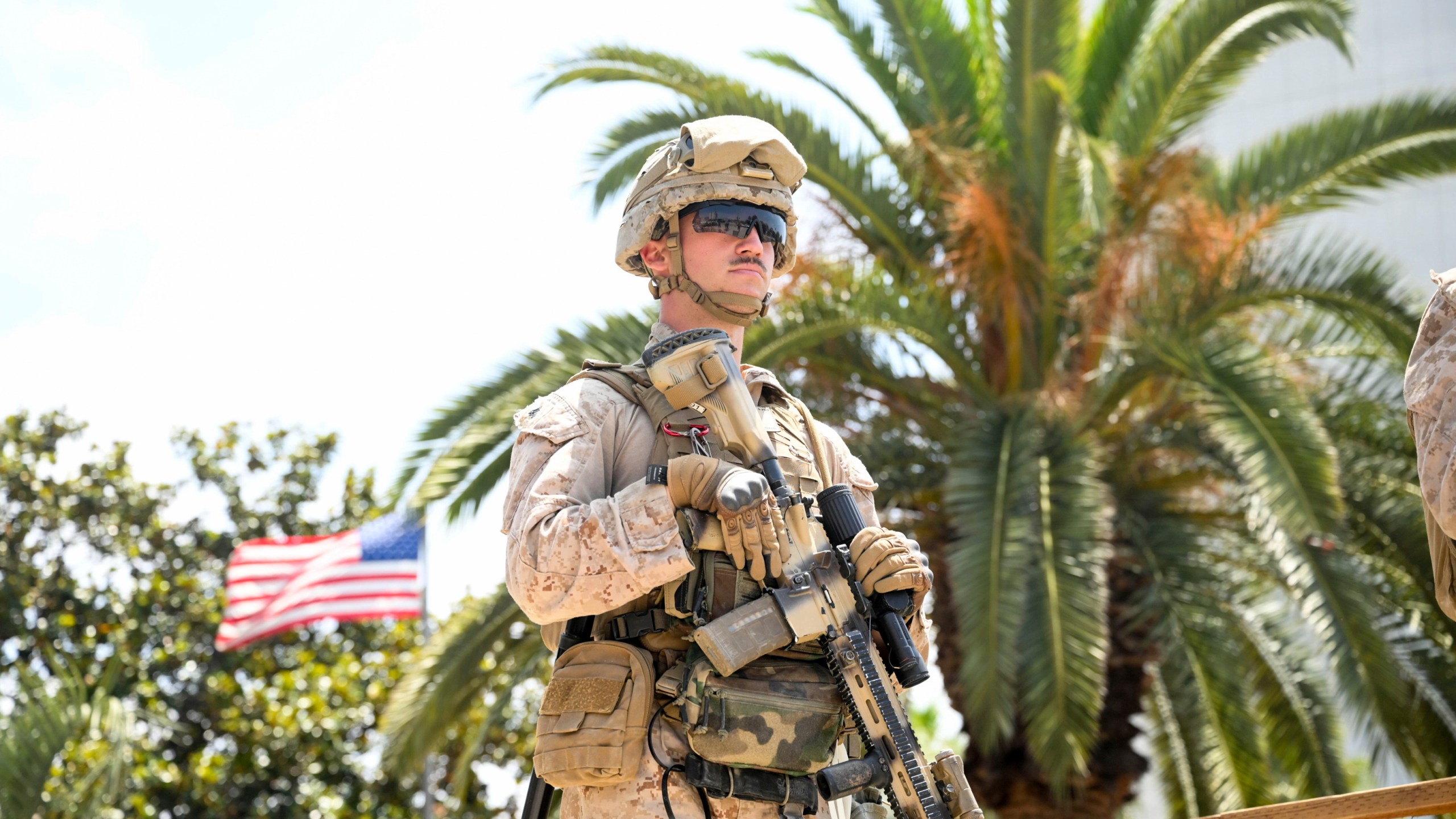 A U.S Marine guards a federal building, Friday, June 13, 2025, in Los Angeles (AP Photo/Noah Berger)