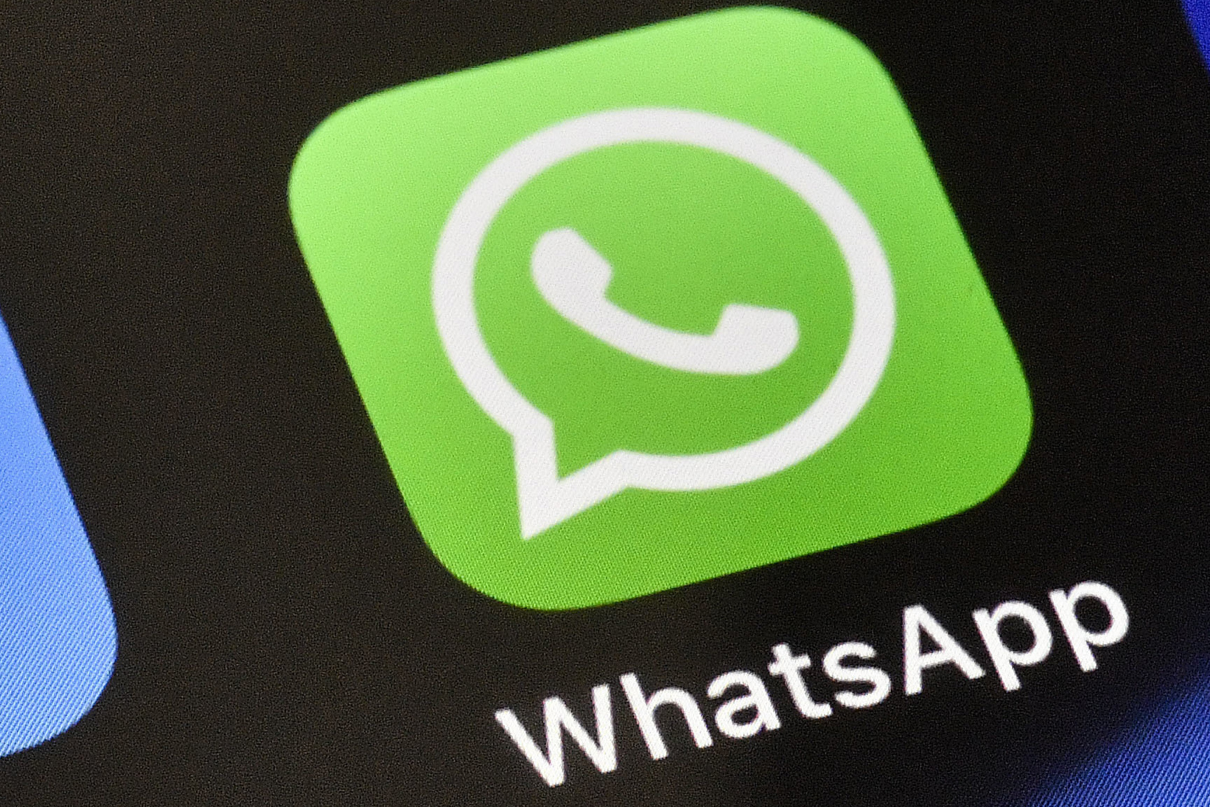 FILE - A WhatsApp icon is displayed on an iPhone, Nov. 15, 2018, in Gelsenkirchen, Germany. (AP Photo/Martin Meissner, File)
