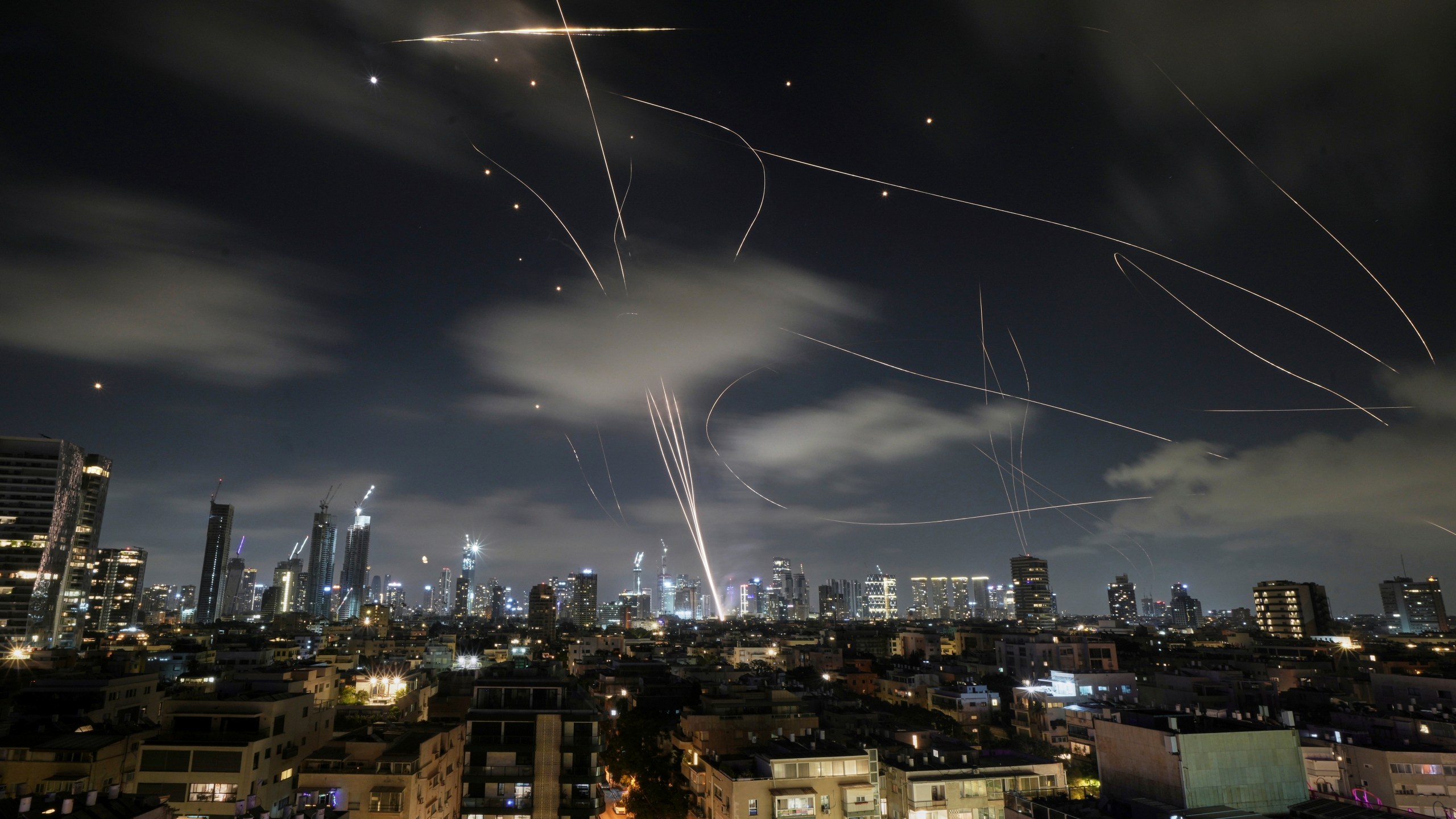 The Israeli Iron Dome air defense system fires to intercept missiles during an Iranian attack over Tel Aviv, Israel, early Wednesday, June 18, 2025. (AP Photo/Leo Correa)