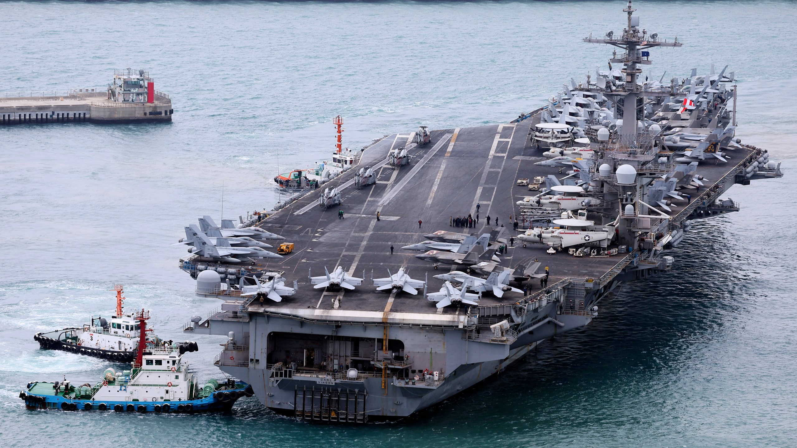 FILE - The USS Carl Vinson aircraft carrier is escorted into a navy port in Busan, South Korea, March 2, 2025. (Son Hyung-ju/Yonhap via AP, File)