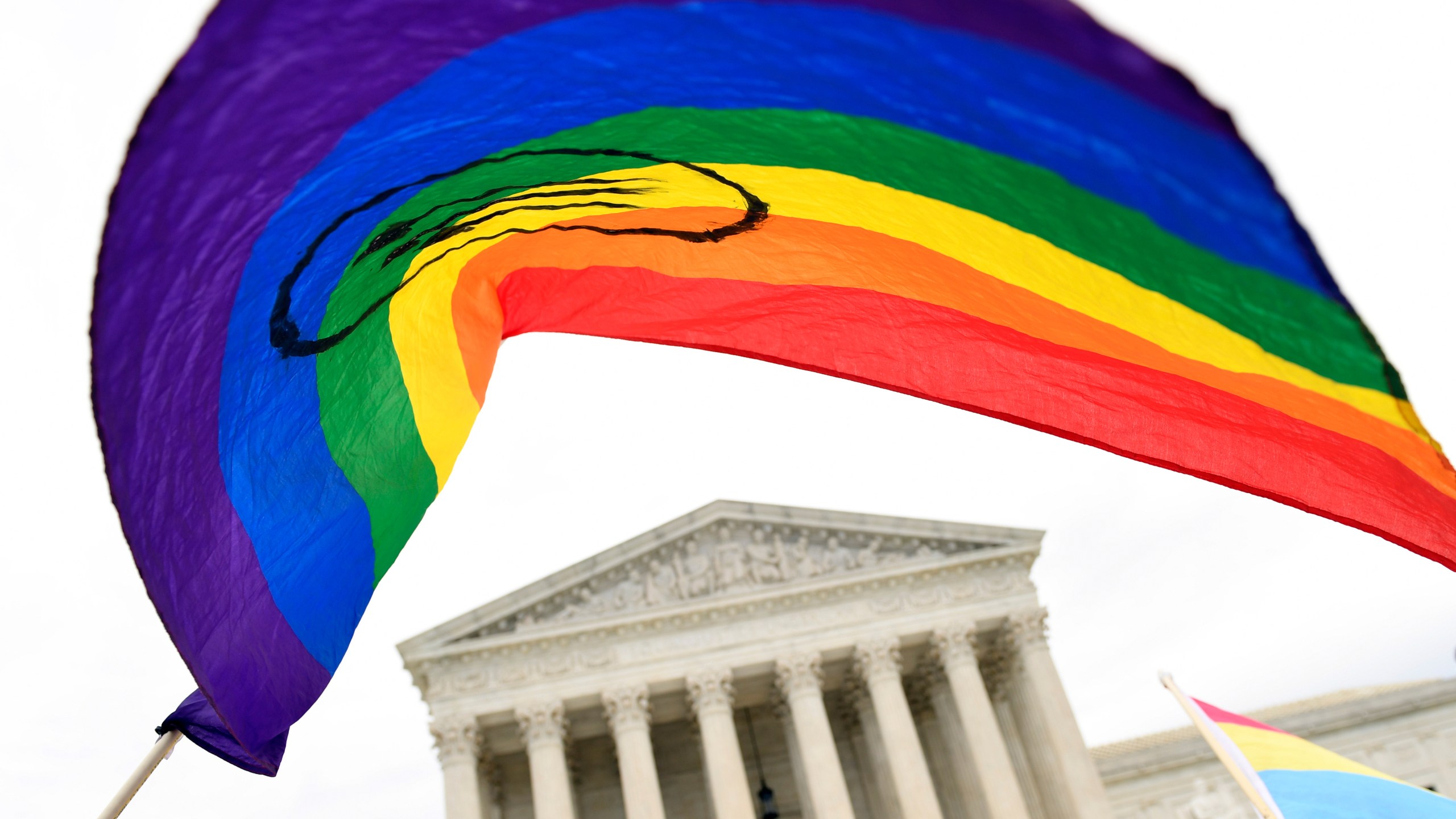 FILE - People gather outside the Supreme Court in Washington, Oct. 8, 2019. (AP Photo/Susan Walsh, File)