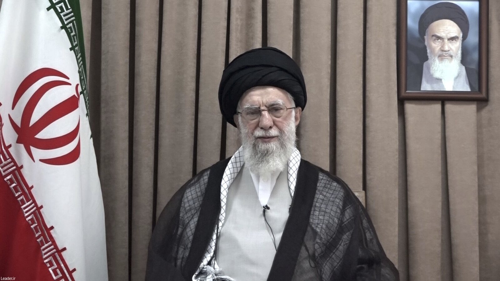 This photo released on Wednesday, June 18, 2025, by the official website of the office of the Iranian supreme leader, shows Supreme Leader Ayatollah Ali Khamenei in a televised speech, under a portrait of the late revolutionary founder Ayatollah Khomeini. (Office of the Iranian Supreme Leader via AP)