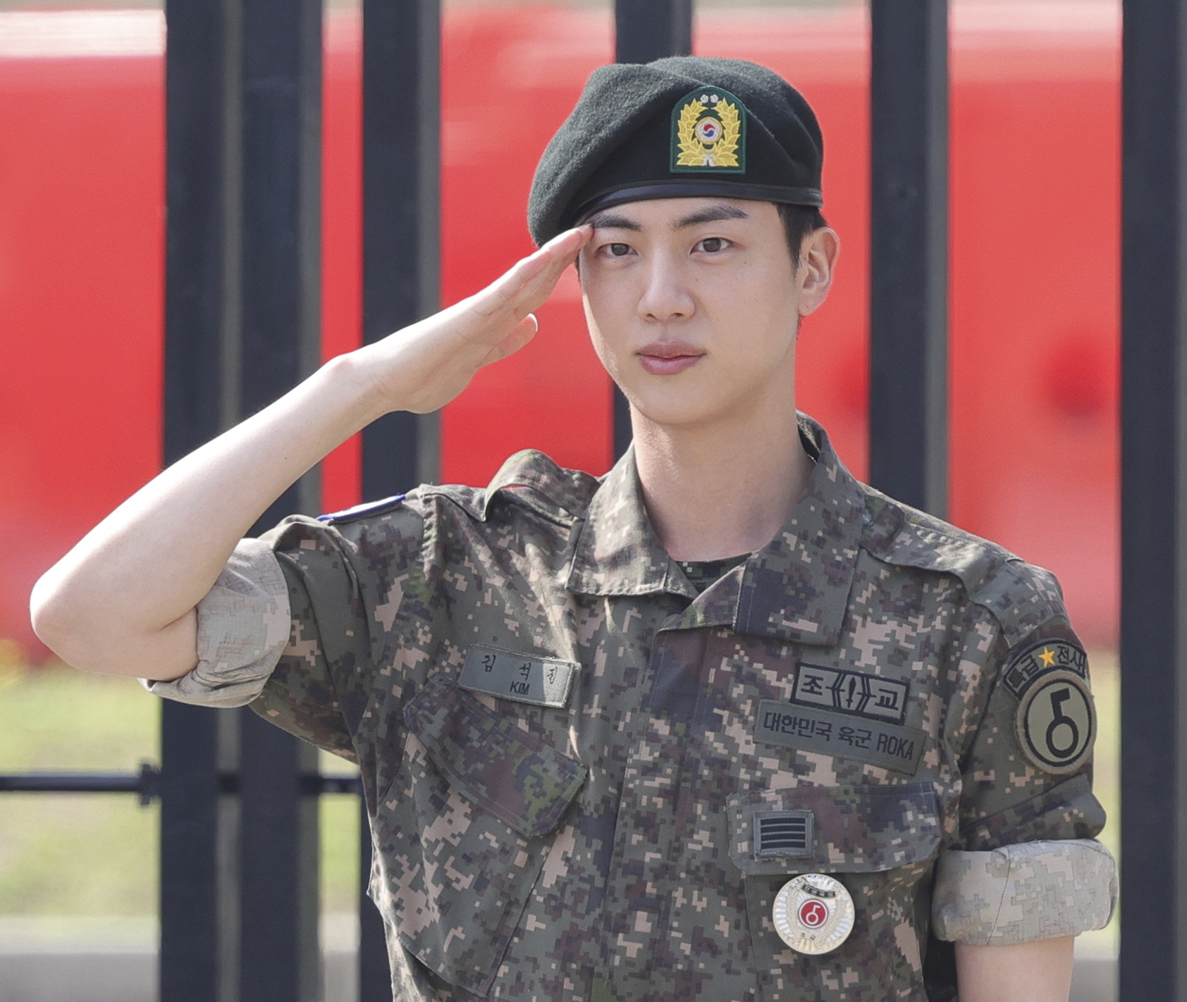 FILE - K-pop band BTS's member Jin salutes after being discharged from a mandatory military service outside of an army base in Yeoncheon, South Korea, Wednesday, June 12, 2024. (Im Byung-shik/Yonhap via AP, File)