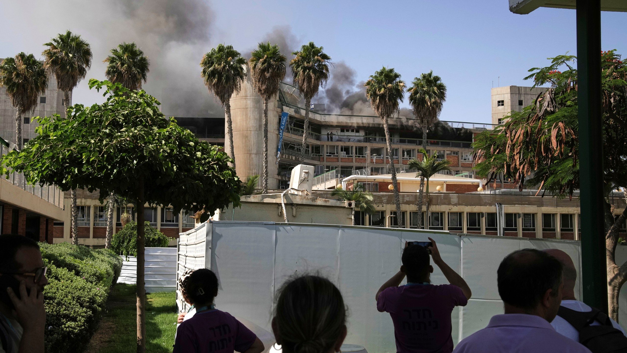 Smokes rises from a building of the Soroka hospital complex after it was hit by a missile fired from Iran in Beersheba, Israel, Thursday, June 19, 2025. (AP Photo/Leo Correa)