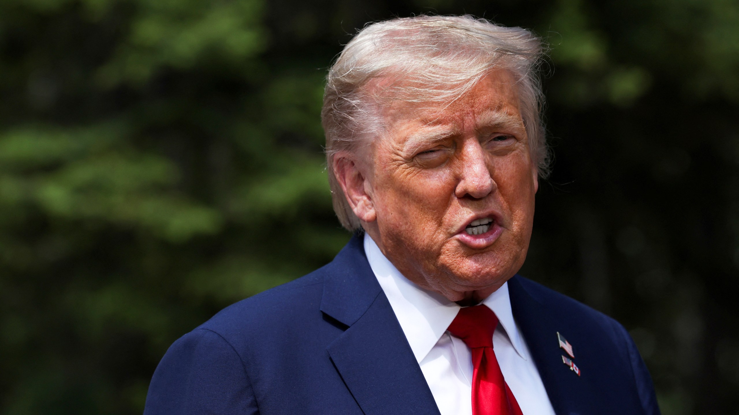 U.S. President Donald Trump speaks to the media during a meeting with Britain's Prime Minister Keir Starmer, at the G7 summit, in Kananaskis, Alberta, Monday, June 16, 2025. (Suzanne Plunkett/Pool Photo via AP)
