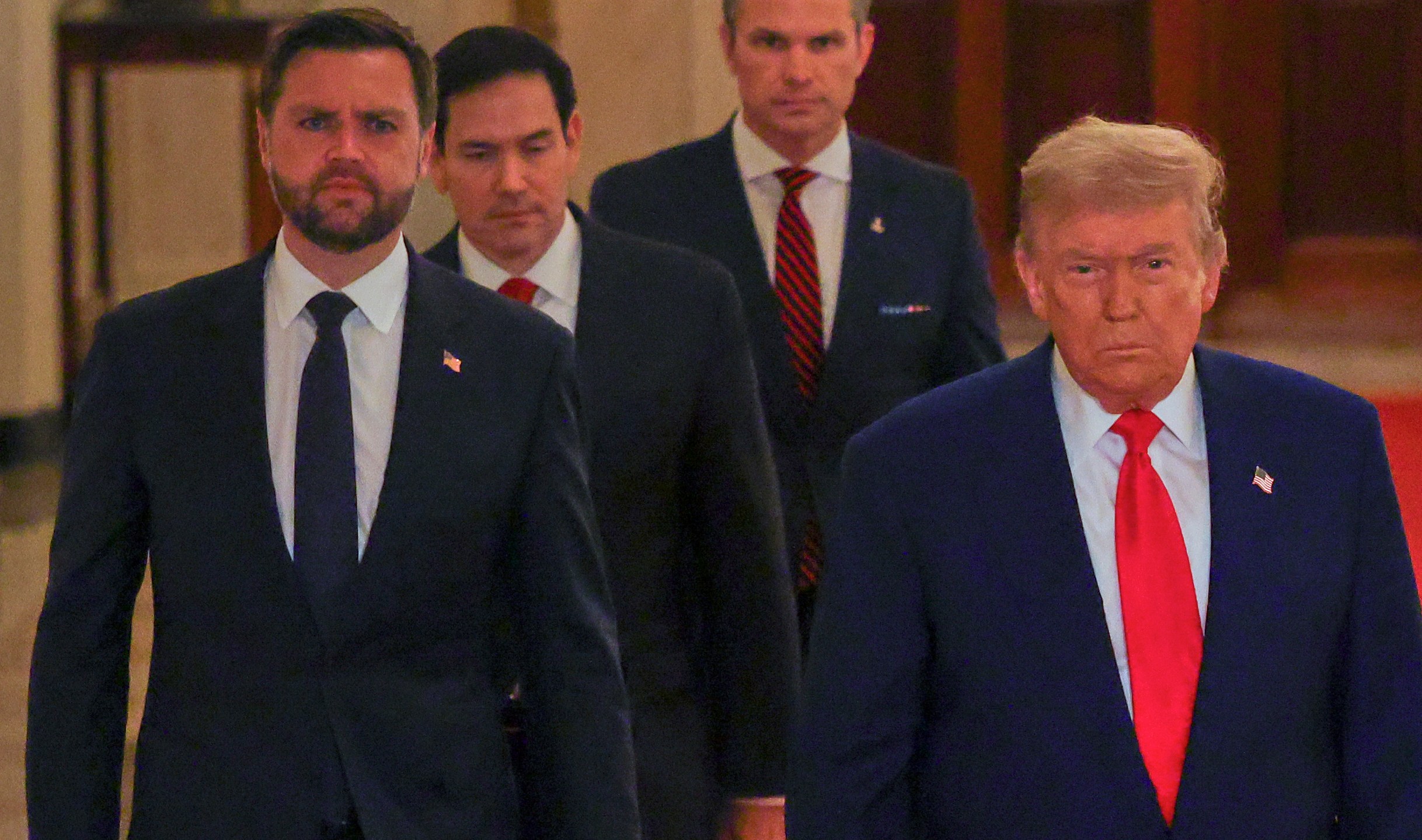President Donald Trump arrives with Vice President JD Vance, Secretary of State Marco Rubio and Defense Secretary Pete Hegseth to speak from the East Room of the White House in Washington, Saturday, June 21, 2025, after the U.S. military struck three Iranian nuclear and military sites, directly joining Israel's effort to decapitate the country's nuclear program. (Carlos Barria/Pool via AP)
