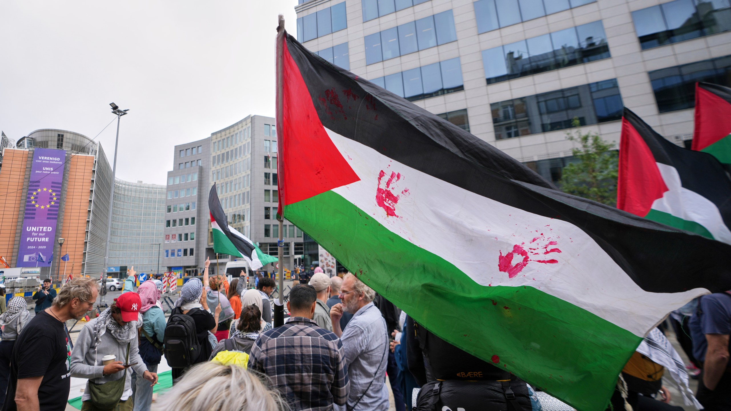 People attend a protest in support of Palestinians outside a meeting of EU foreign ministers at the European Council building in Brussels, Monday, June 23, 2025. (AP Photo/Virginia Mayo)