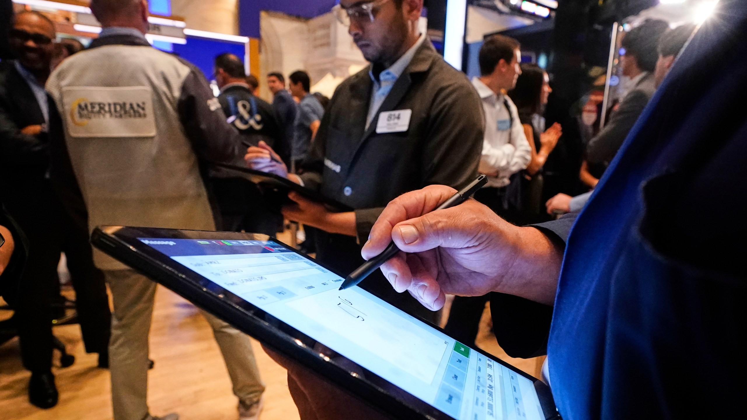 Traders workon the floor of the New York Stock Exchange, Monday, June 23, 2025. (AP Photo/Richard Drew)