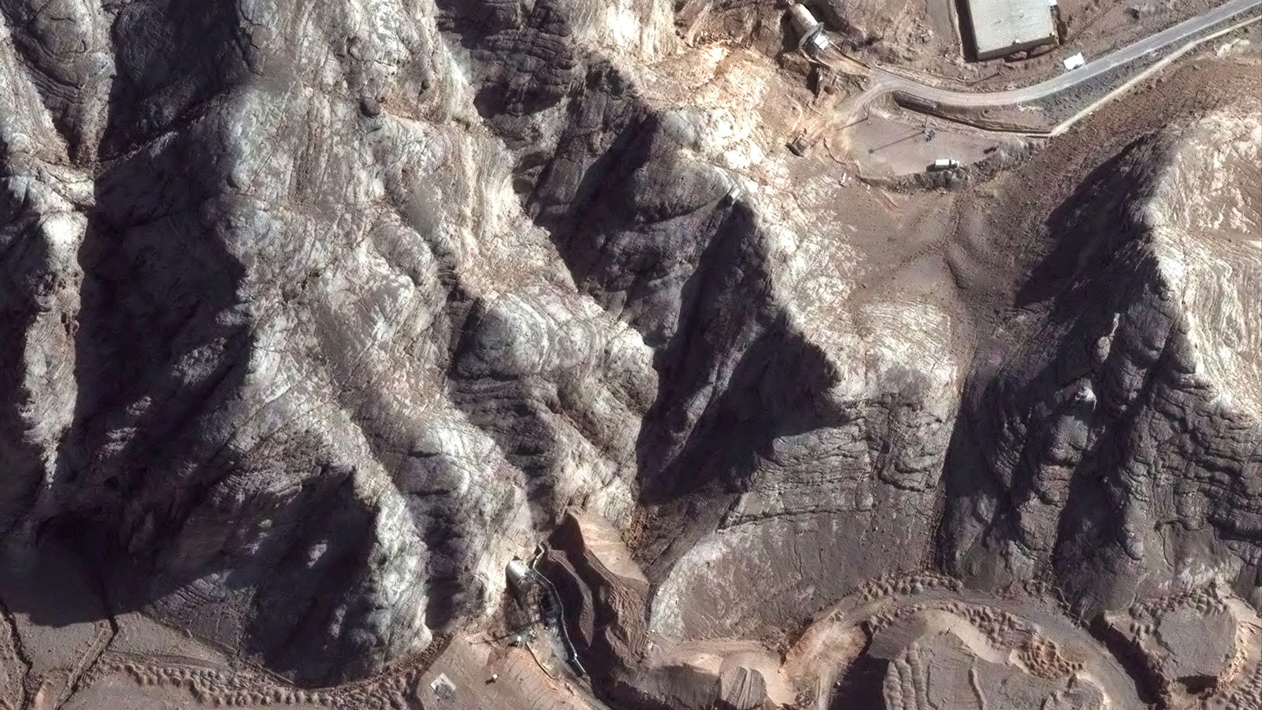 This Tuesday, June 24, 2025, satellite image provided by Maxar Technologies shows tunnel entrances at Isfahan Nuclear Technology Center in Iran after recent airstrikes. (Maxar Technologies via AP)