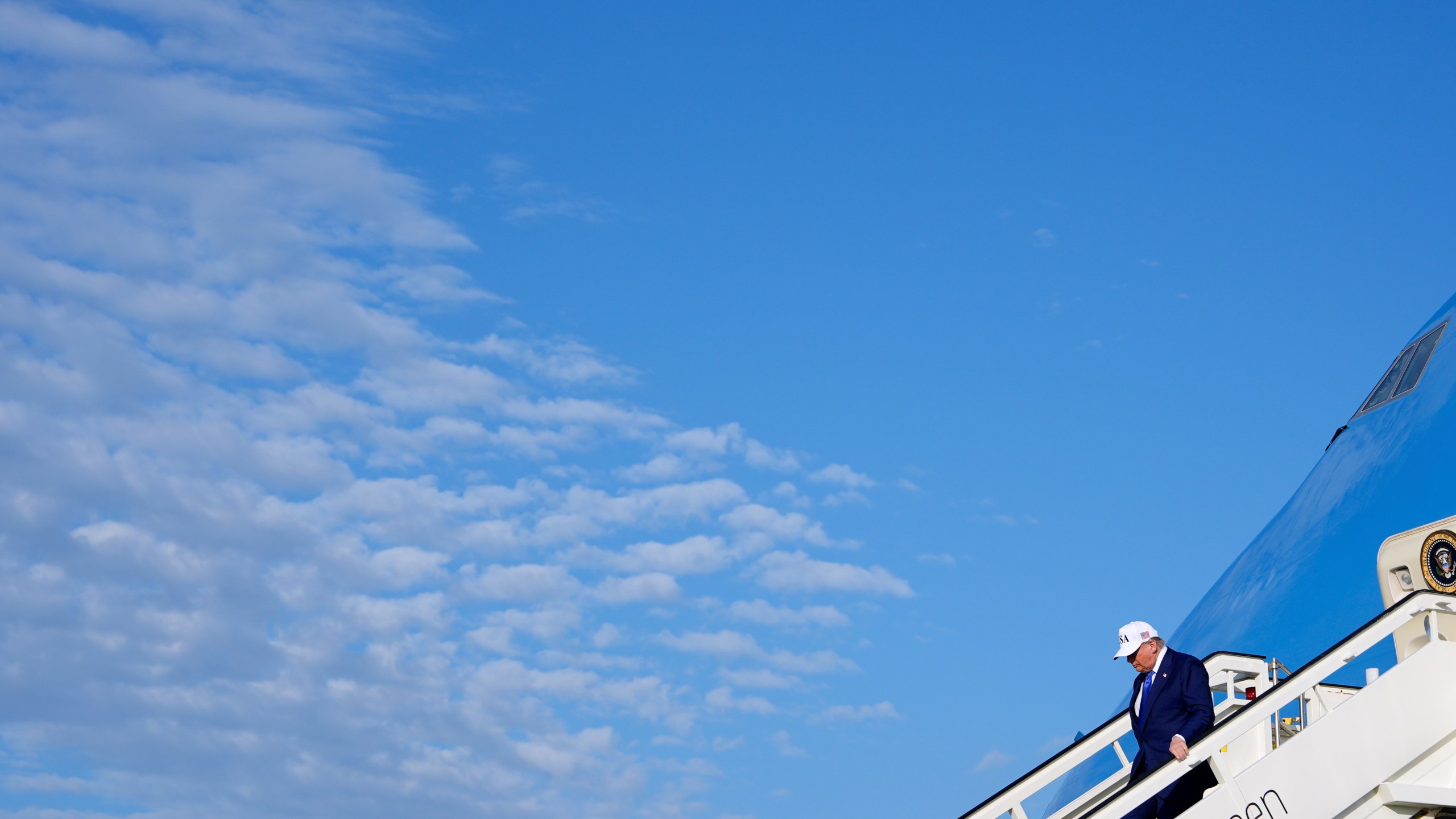 President Donald Trump exits Air Force One as he arrives at Amsterdam Schiphol Airport ahead of the NATO summit, taking place in The Hague, Netherlands, Tuesday, June 24, 2025. (AP Photo/Alex Brandon)