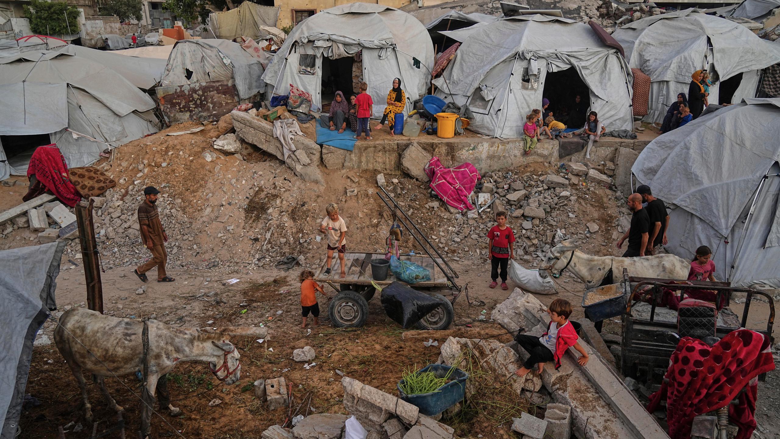 Displaced Palestinians live in a tent camp in Gaza City, Monday, June 23, 2025. (AP Photo/Jehad Alshrafi)