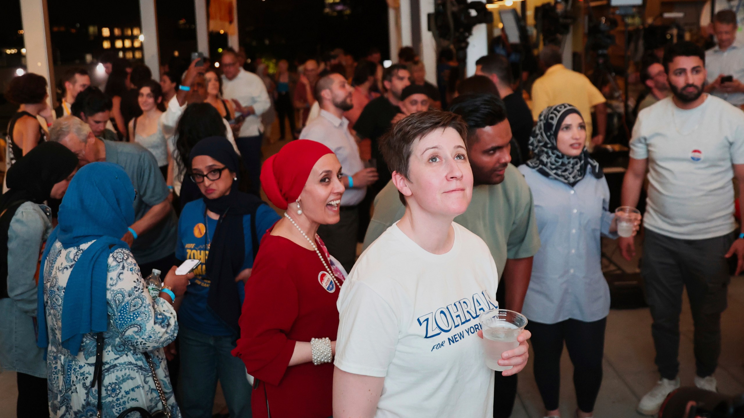 Supporters of Democratic mayoral candidate Zohran Mamdani watch results come in at his primary election party, in New York, Tuesday, June 24, 2025. (AP Photo/Heather Khalifa)