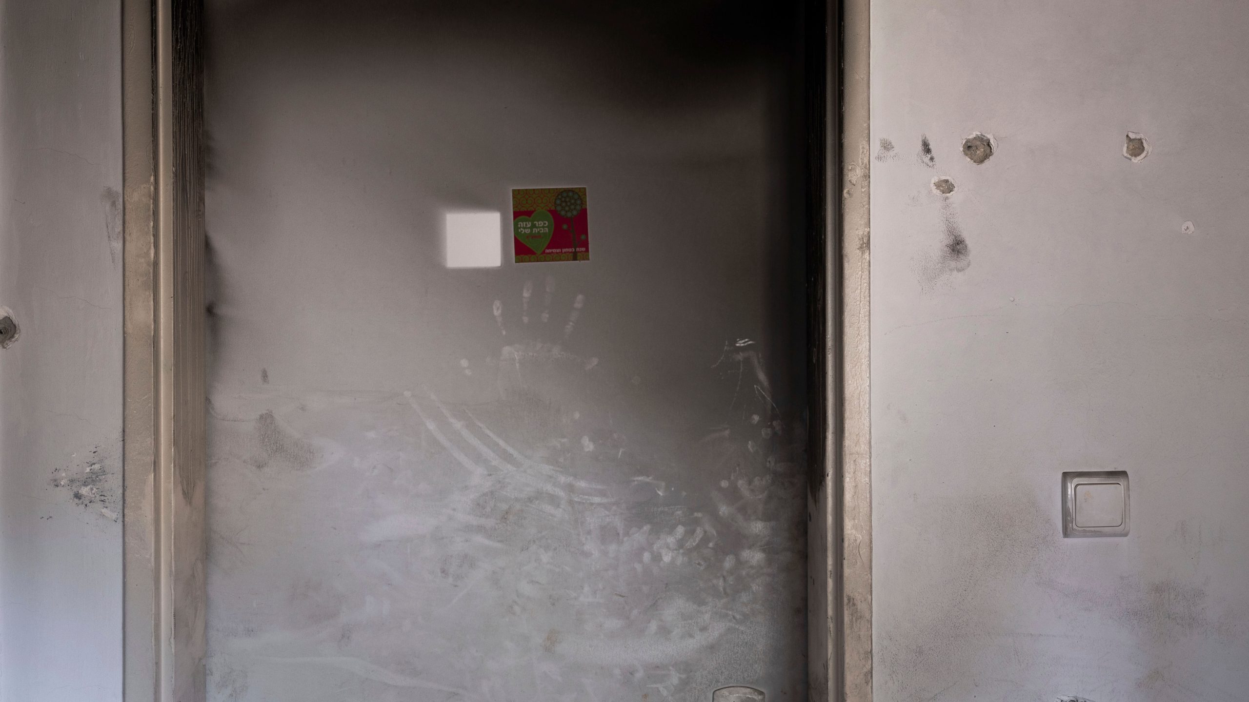 Bullet holes and smoke damage are seen in the bedroom of Ziv Berman, 26, in Kibbutz Kfar Aza, Israel, on Monday, June 24, 2024. Berman and his twin brother, Gali, were abducted on Oct. 7, 2023. (AP Photo/Oded Balilty, File)