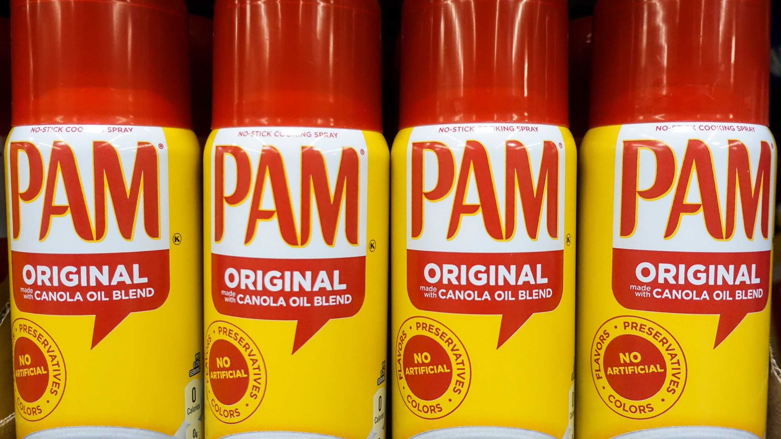 FILE - Cans of PAM cooking spray, a Conagra brand, rest on a supermarket shelf in Cincinnati, June 25, 2019. (AP Photo/John Minchillo, File)